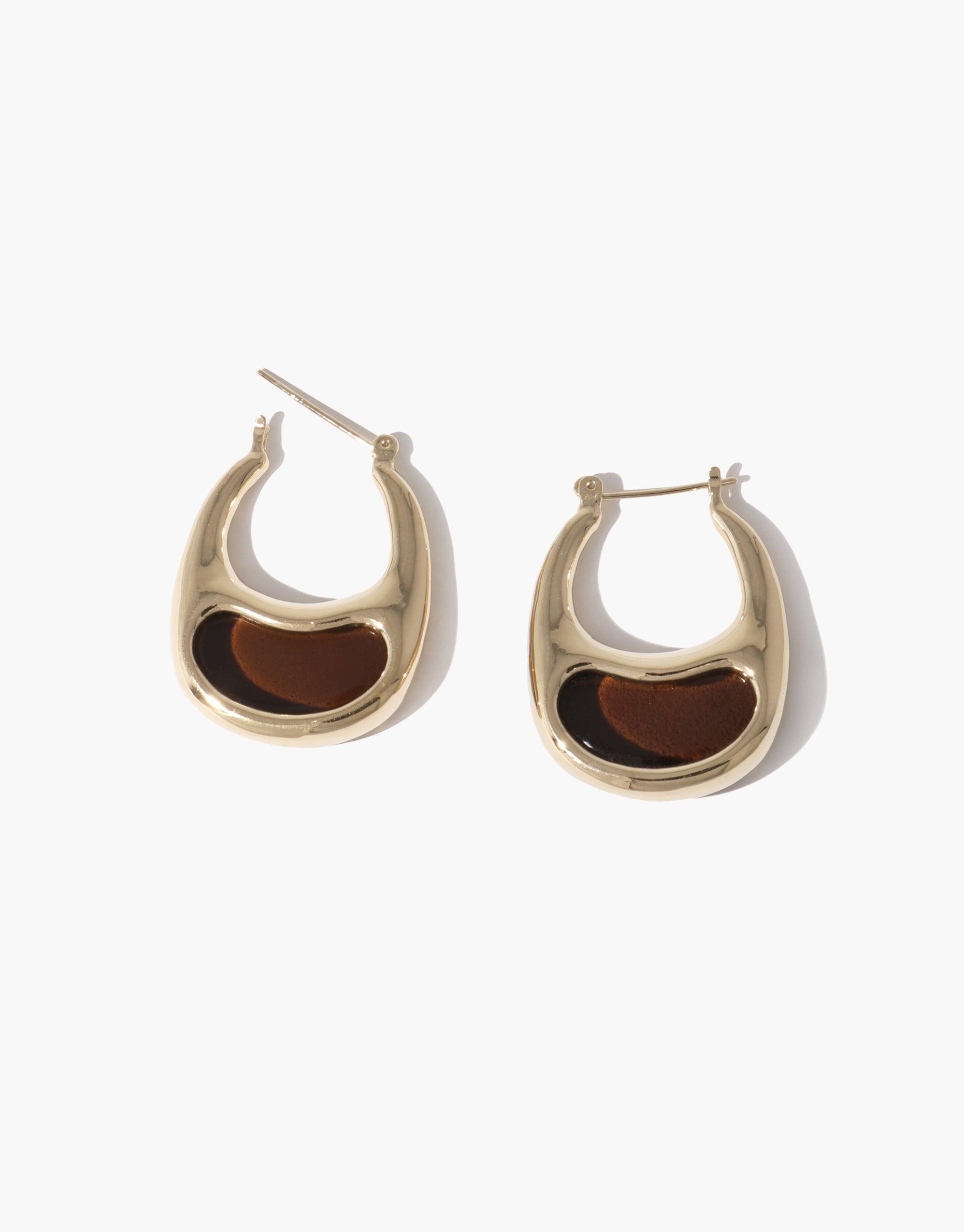 Elegant gold-toned hoop earrings with brown inlay, inspired by bean shapes. Modern design showcases nature's organic curves and patterns. Bean Hoop Earrings | Large, perfect for adding a touch of natural beauty to any outfit. CLED