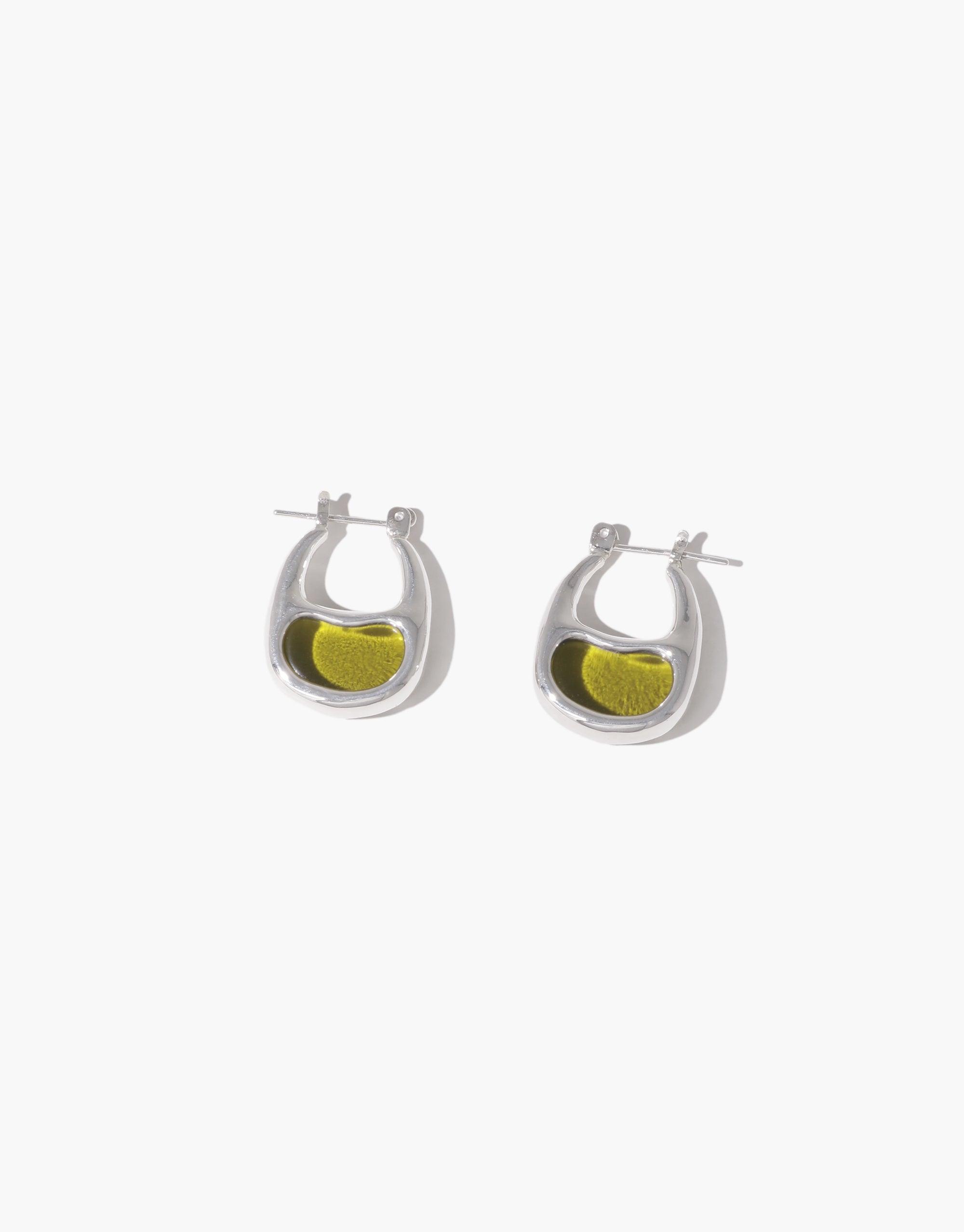 Elegant silver hoop earrings featuring a unique bean-shaped design with a vibrant yellow accent, inspired by nature's organic forms. Bean Hoop Earrings | Small showcase delicate craftsmanship and sustainable style. CLED