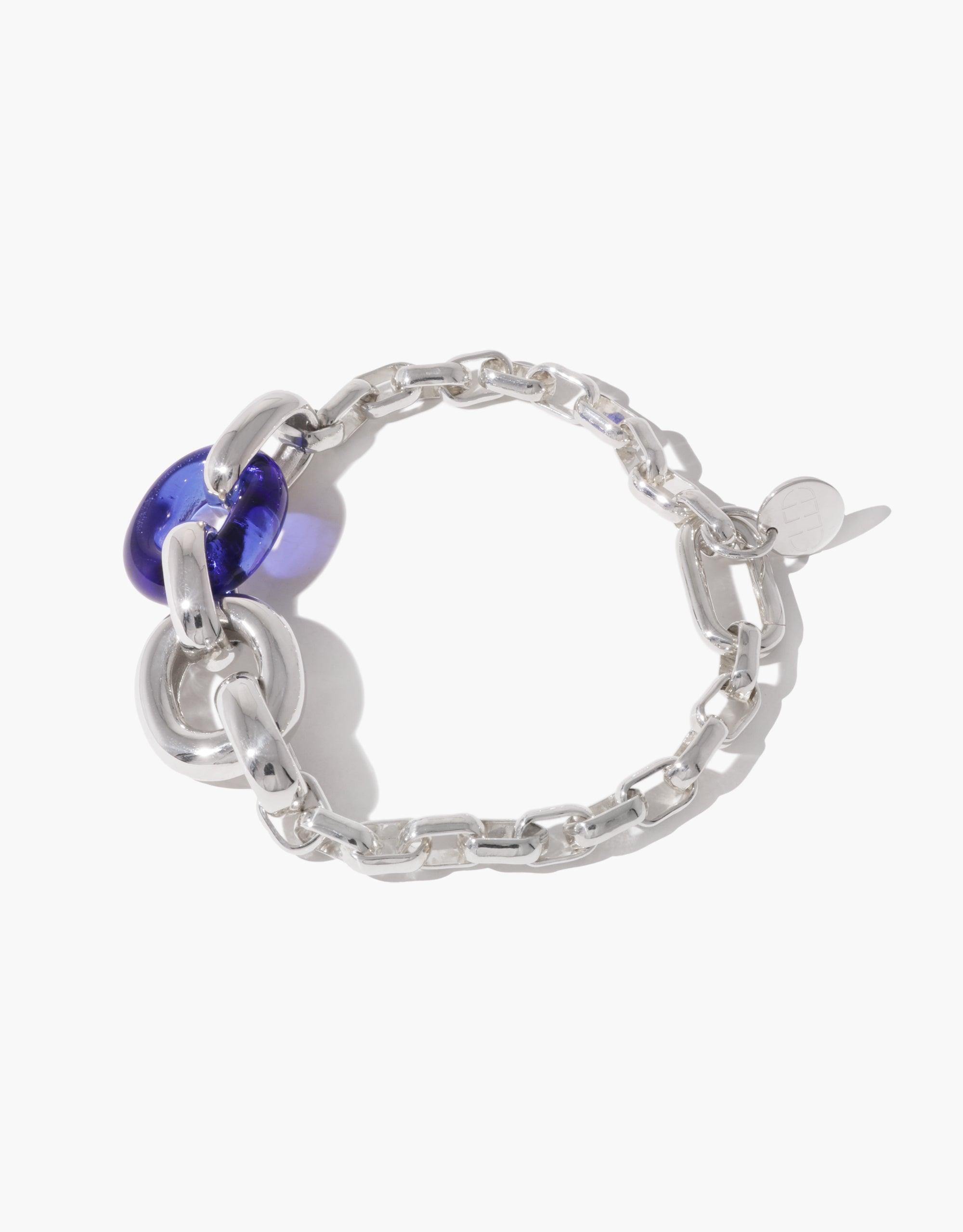 Stylish Loop Chain Bracelet featuring silver-tone links and a vibrant blue glass bead, symbolizing unity and upcycling. Elegant and meaningful jewelry piece from the In The Loop collection. CLED Loop Chain Bracelet