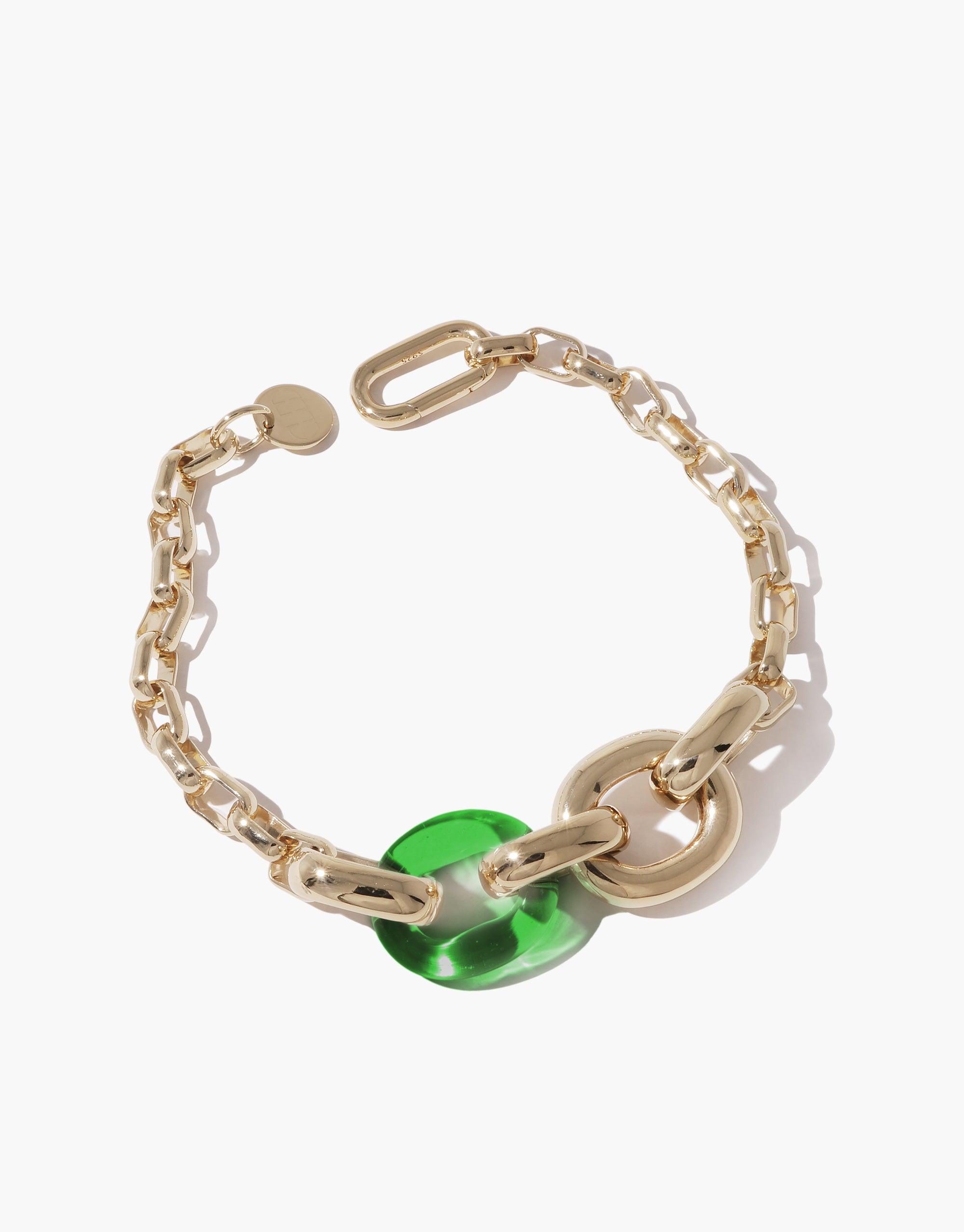 Elegant Loop Chain Bracelet featuring gold-toned links with a vibrant green upcycled accent, symbolizing unity and sustainability. Part of the In The Loop collection, this versatile piece showcases CLED's commitment to eco-friendly fashion. Loop Chain Bracelet by CLED.