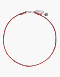 Adjustable red cotton cord necklace with silver clasp and extender chain, ideal for attaching charms. Versatile 16-18 inch length. Minimalist design perfect for layering or wearing solo. Sustainably crafted accessory. Cord Necklace by CLED.