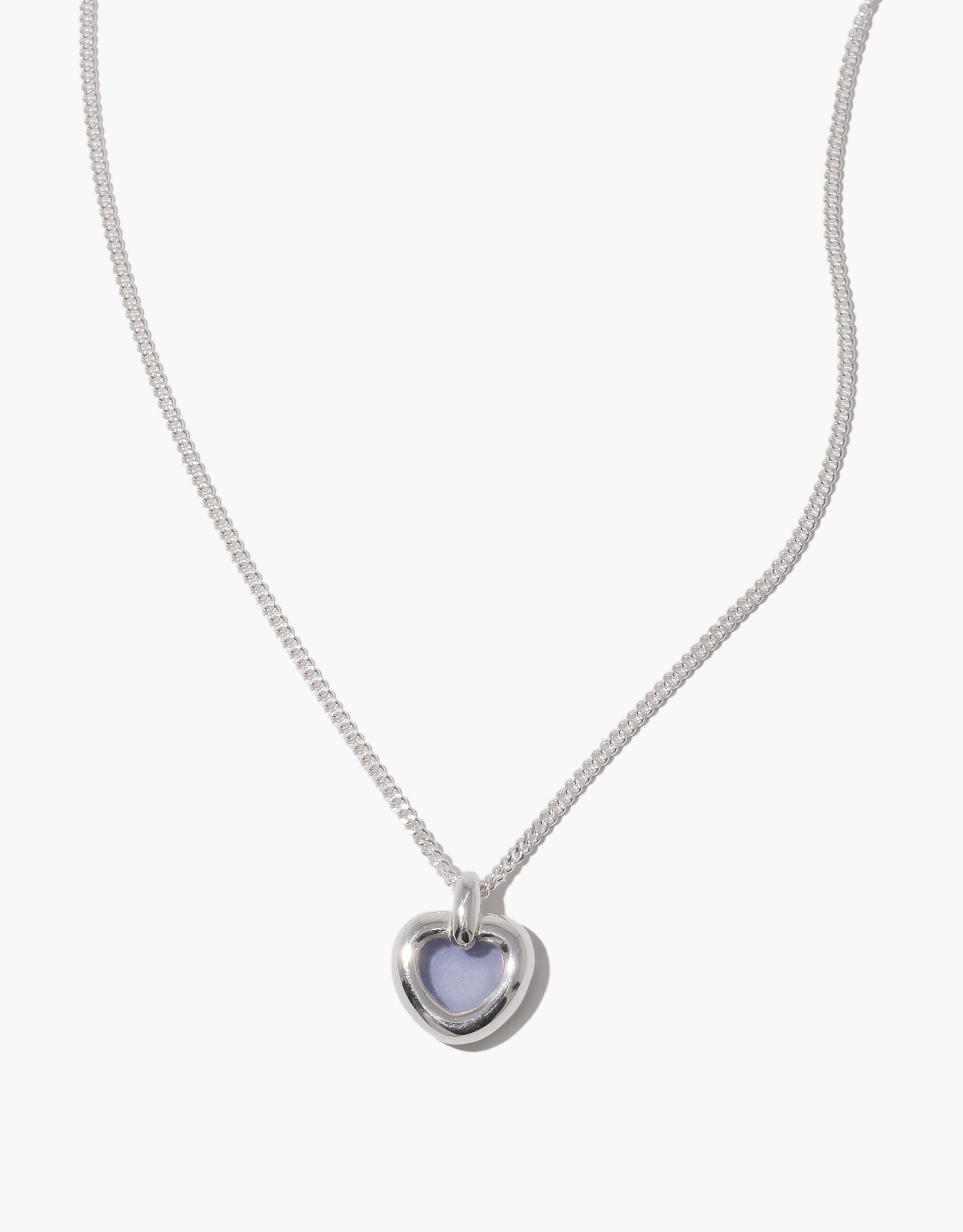 Core Heart Necklace | Small features a silver chain with a lightweight, softly rounded light blue heart pendant, embodying CLED's eco-conscious design by transforming discarded glass into elegant jewelry.