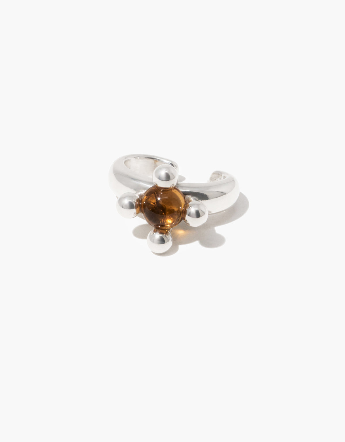 Picot Ear Cuff with a warm brown amber glass Eco Gem set between small silver beads on an open, non-pierced curve. Picot Ear Cuff by CLED.