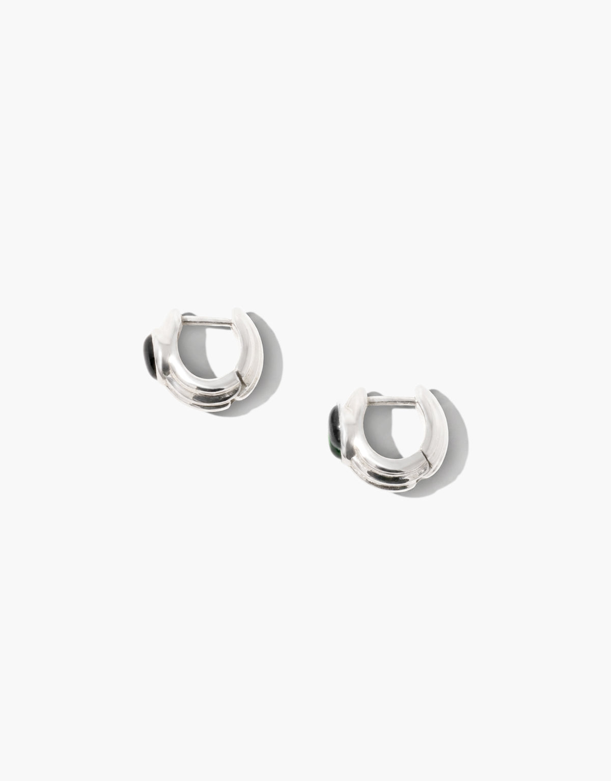 Scallop Hoop Earrings with a scalloped sterling silver hoop holding a single black basalt glass Eco Gem close to the ear. Everyday lace-inspired design from the Las Collection. Scallop Hoop Earrings by CLED.