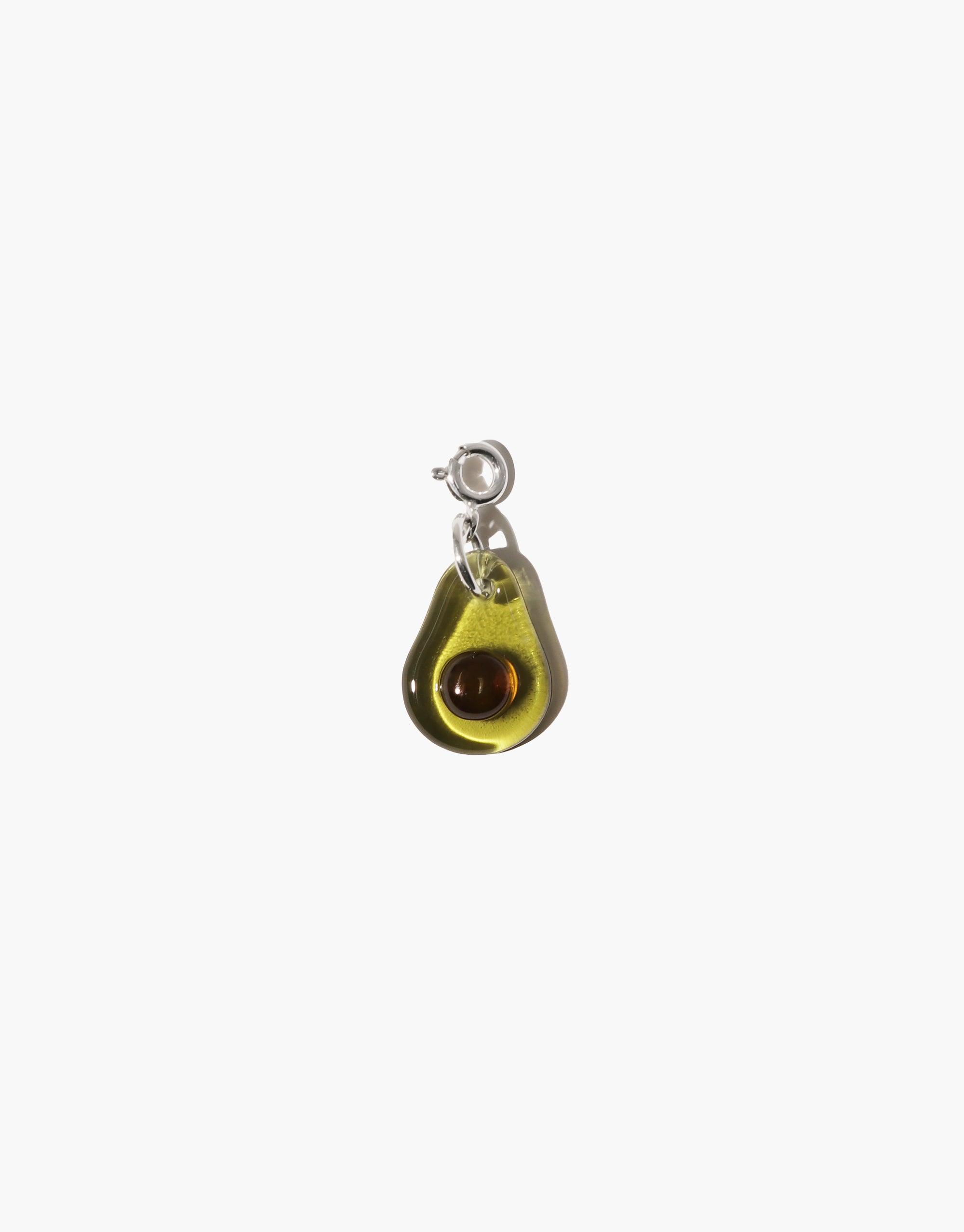Avocado Icon Charm featuring a green glass pendant in the shape of an avocado with a brown seed, attached to a silver clasp. Handcrafted eco-friendly jewelry accessory for necklaces or bracelets. Avocado | Icon Charm by CLED