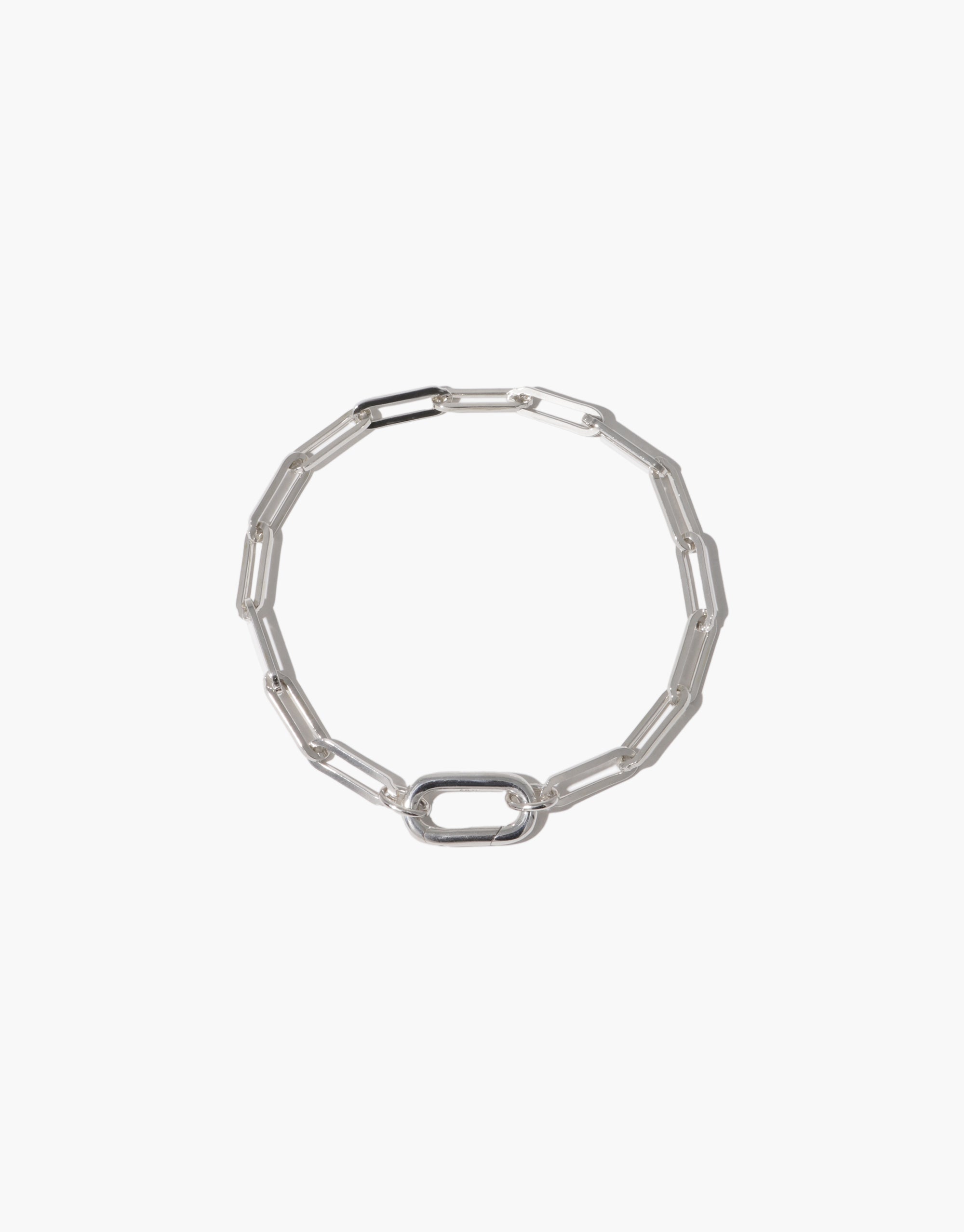 Sleek silver chain bracelet with elongated oval links, creating a modern and versatile accessory. Icon Chain Bracelet | D perfect for layering or wearing alone as a statement piece. Customize with charms or wear as is for a minimalist look. CLED