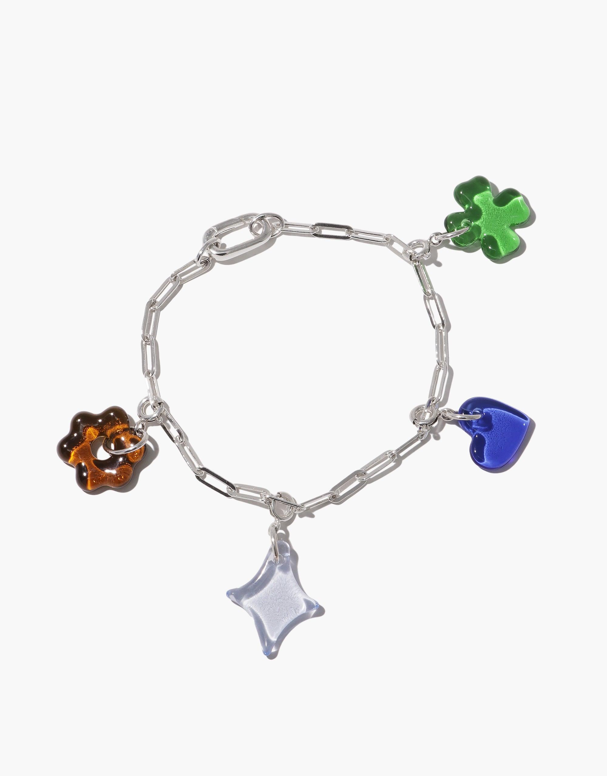 Silver chain bracelet with colorful glass charms including green clover, blue heart, orange flower, and clear star. Customizable Icon Chain Bracelet | E for a unique, bold style. CLED