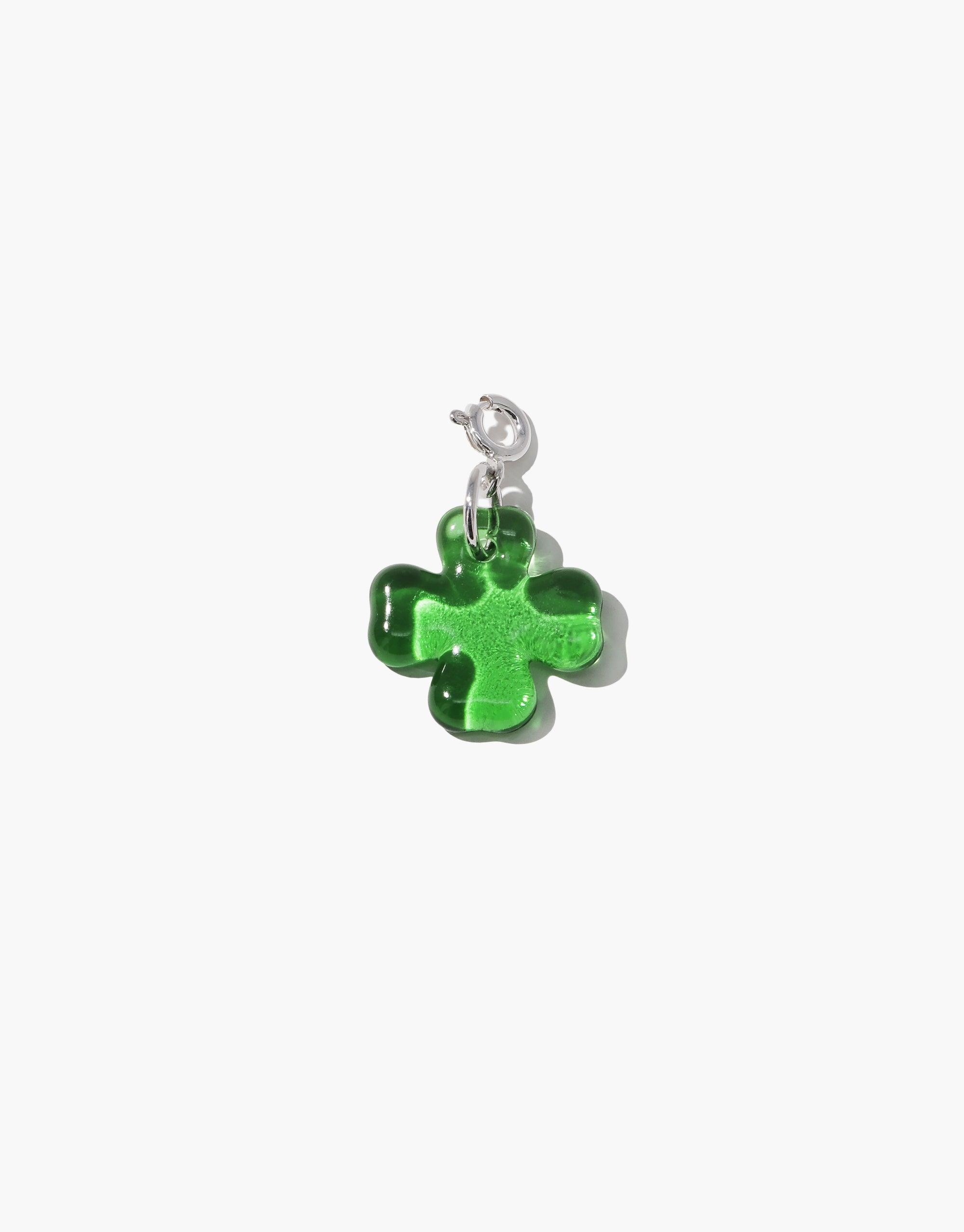 Clover Icon Charm: Vibrant green four-leaf clover pendant with silver clasp, perfect for adding luck and style to necklaces or bracelets. Playful and distinctive shape, ideal for customizing jewelry. Clover | Icon Charm by CLED