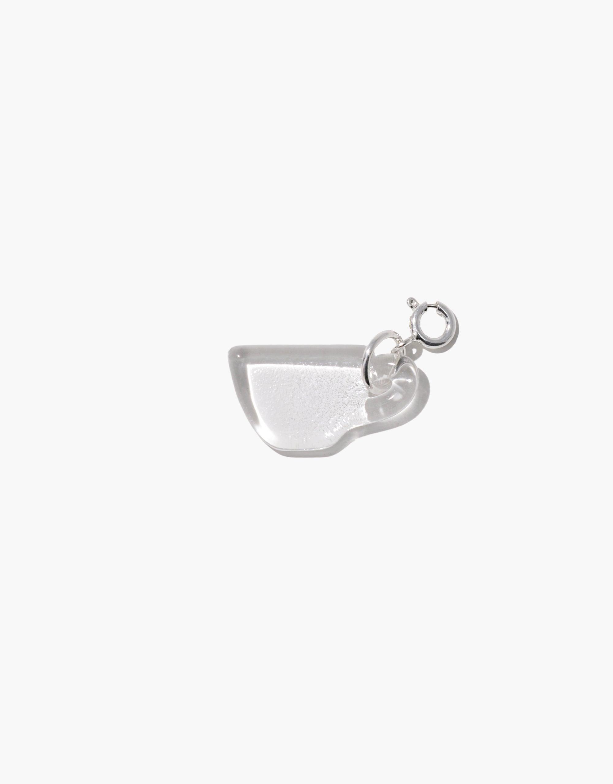 Silver-toned charm in the shape of an espresso cup with a delicate handle, perfect for adding a playful touch to necklaces or bracelets. Espresso Cup | Icon Charm by CLED