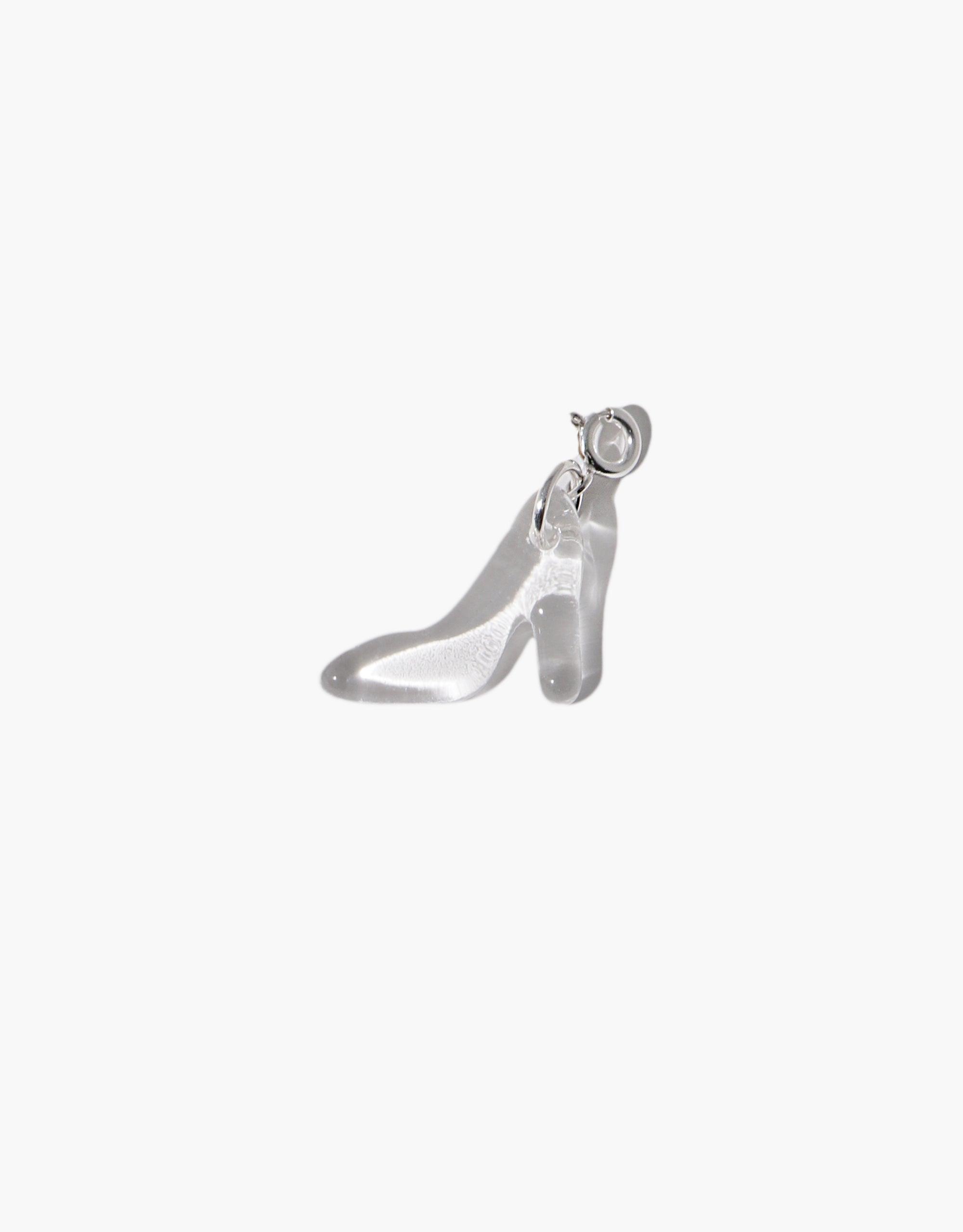 Stylish silver high heel charm pendant with curved silhouette and delicate details, perfect for adding a touch of elegance to jewelry. High Heel Icon Charm by CLED