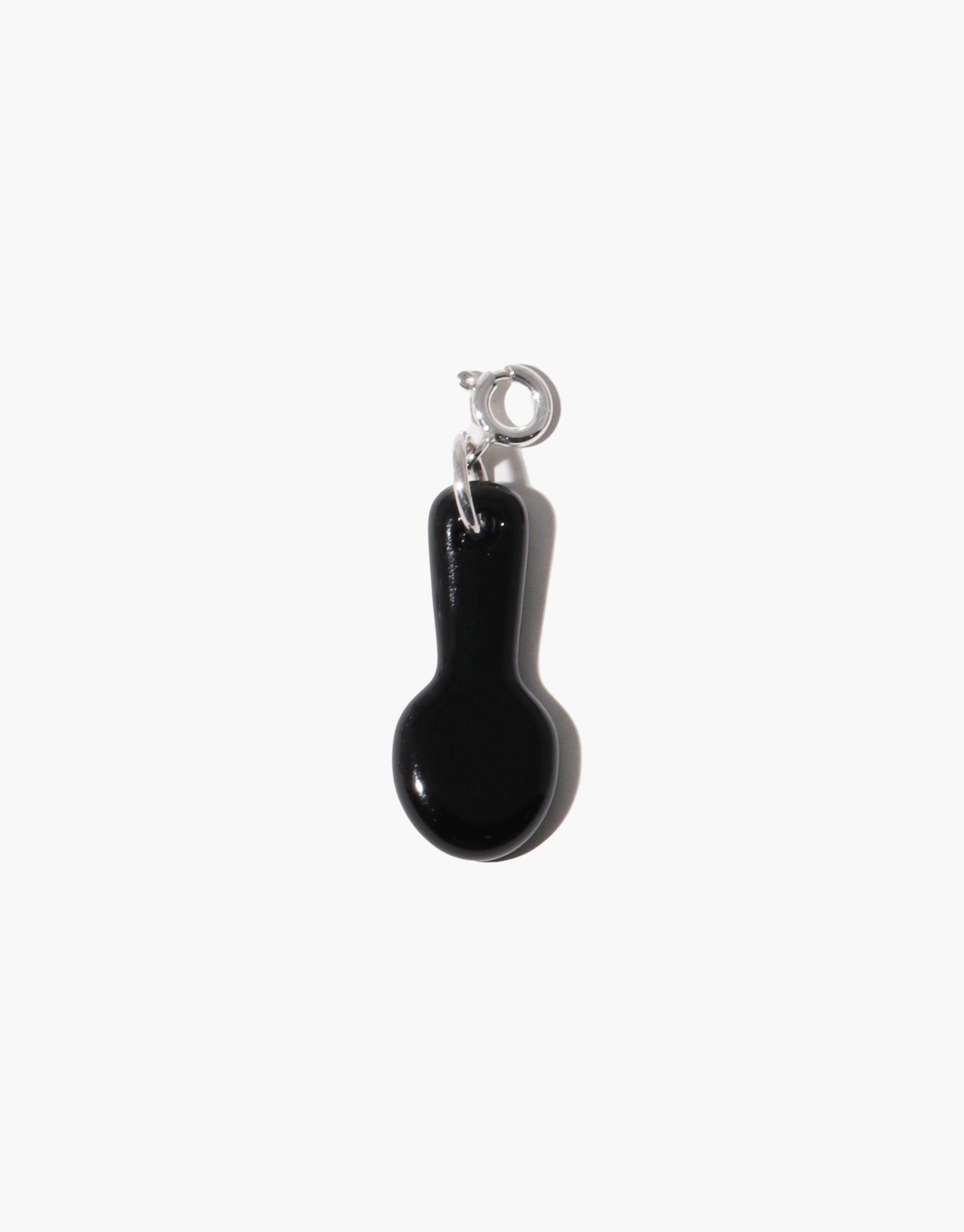 miniature black spoon-shaped charm pendant with silver clasp, perfect for accessorizing necklaces or bracelets. Unique Icon Charm design adds playful flair to jewelry. Fork | Icon Charm by CLED