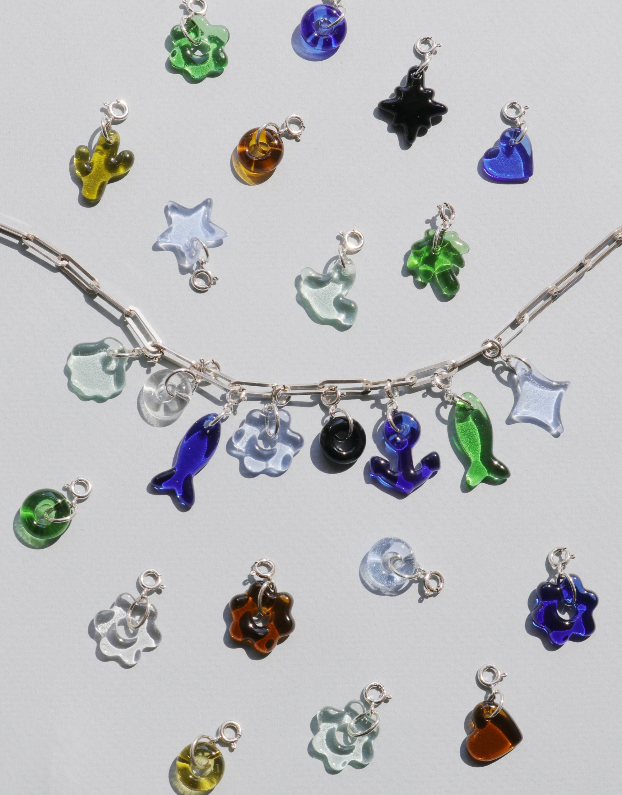Anchor Icon Charm necklace with various colorful glass charms on a silver chain by CLED
