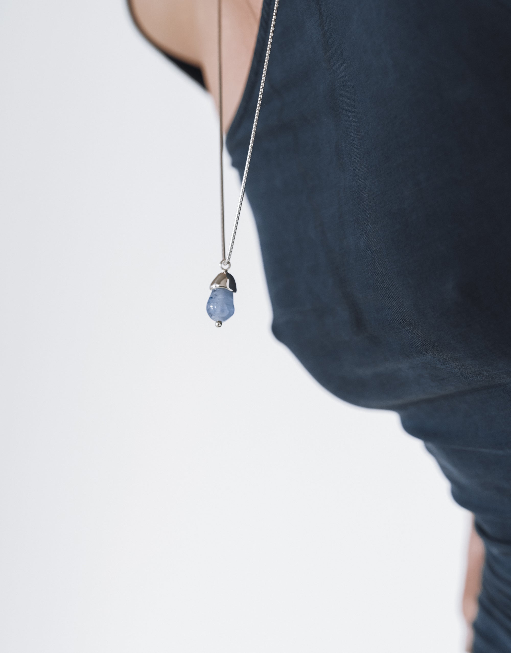 Solace Drop Necklace featuring delicate glass pendant on silver snake chain, showcasing minimalist elegance by CLED