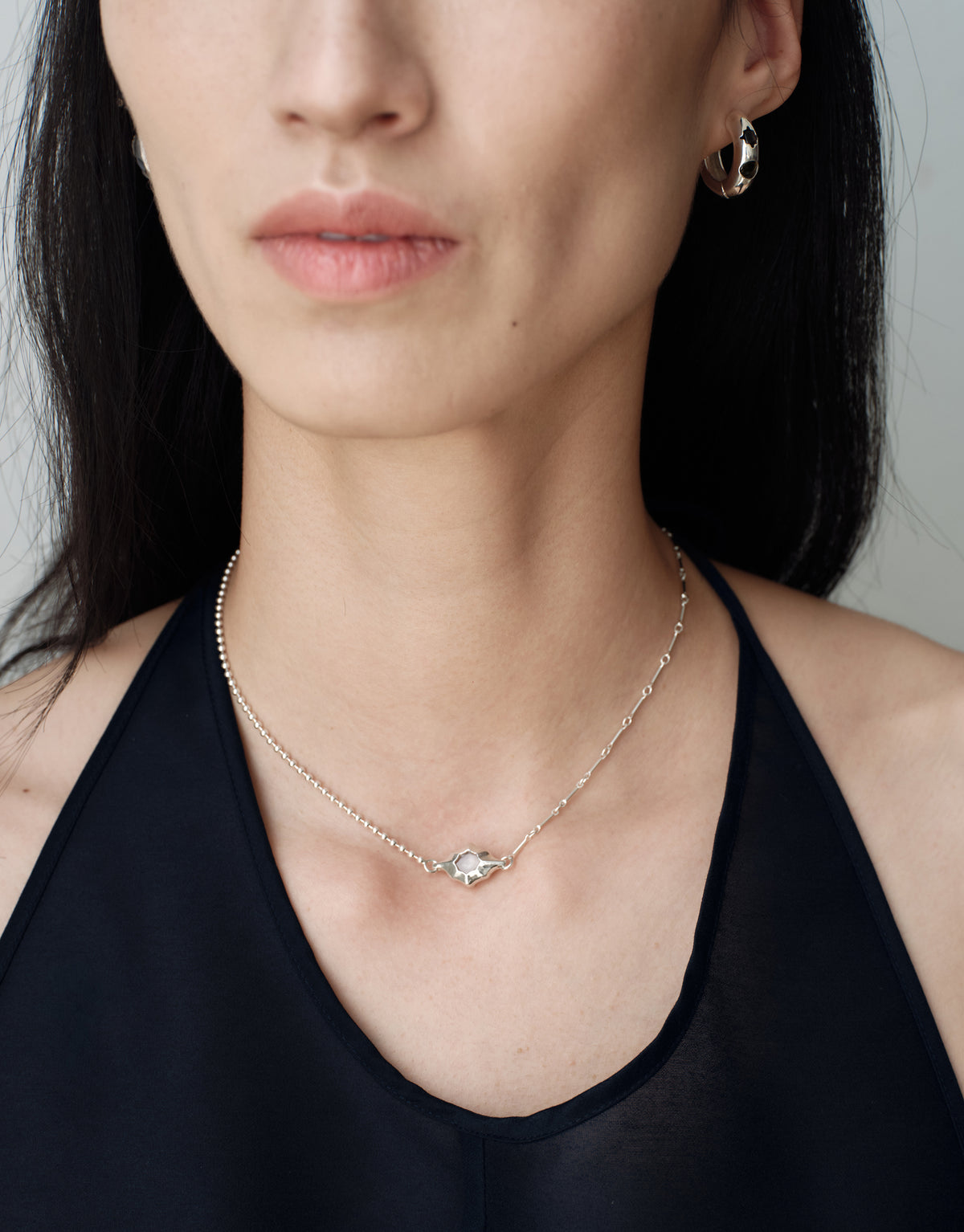 Interlace Necklace worn on the model, upcycled glass Eco Gem set in sterling silver. Handmade in Los Angeles. Interlace Necklace by CLED.