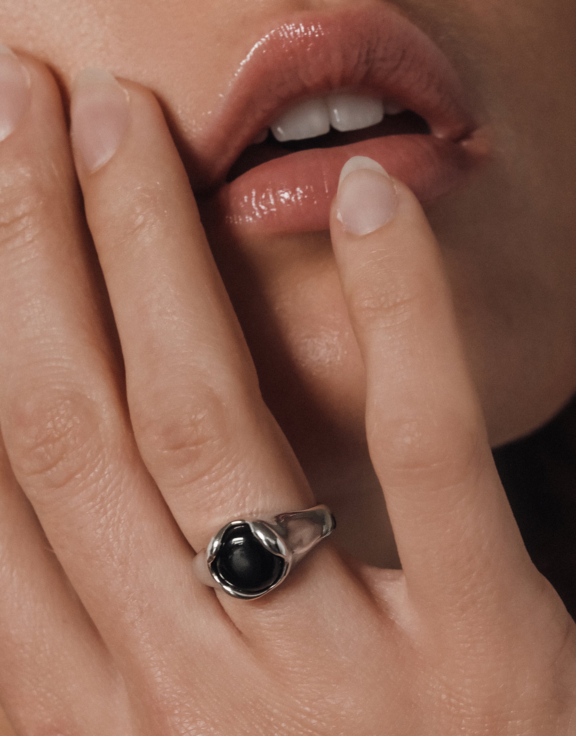 Elegant Orb Ring with black eco gem in silver setting worn on hand, showcasing minimalist design by CLED