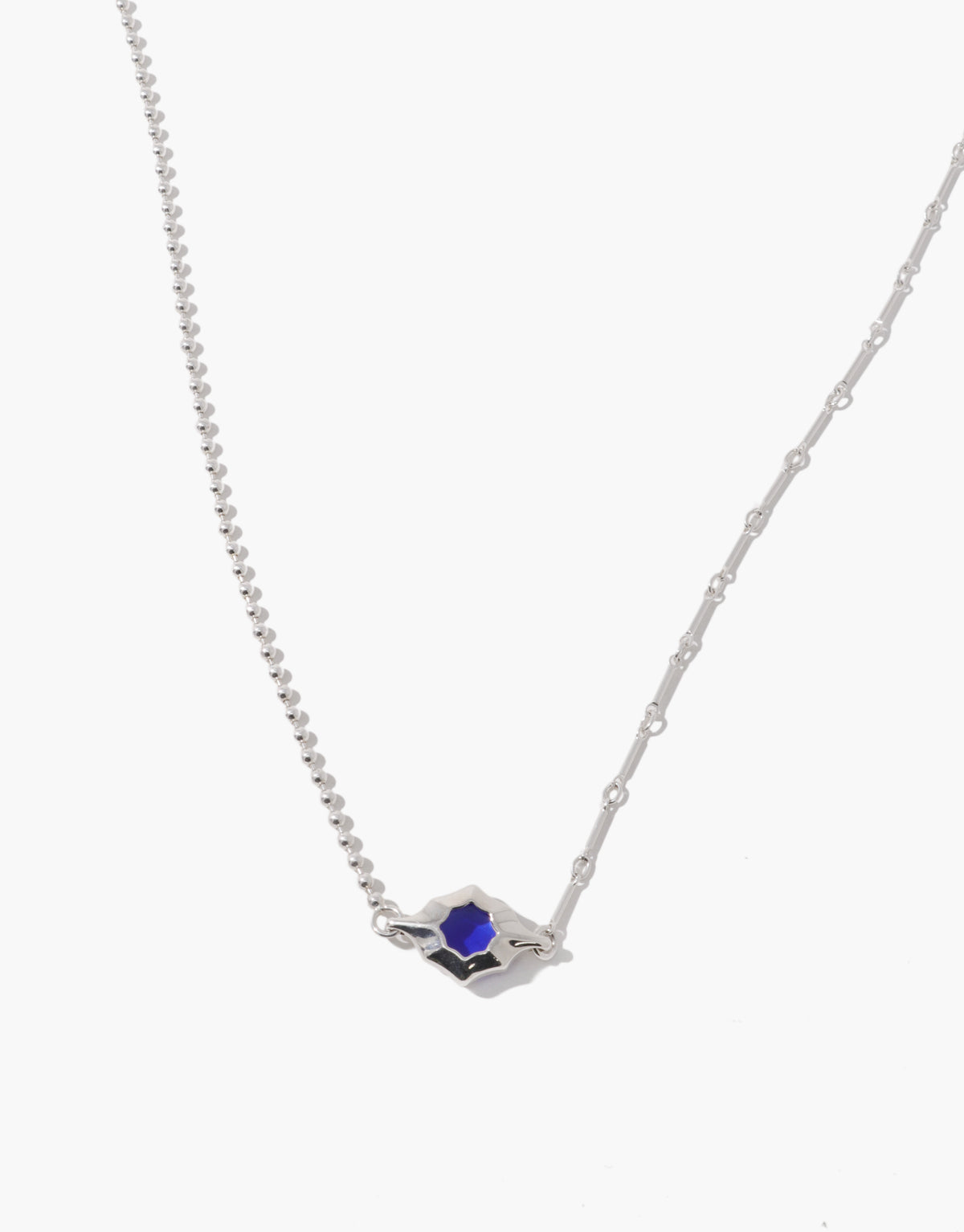 Interlace Necklace holding a blue ocean glass Eco Gem at the point where two different sterling silver chains meet. Interlace Necklace by CLED.