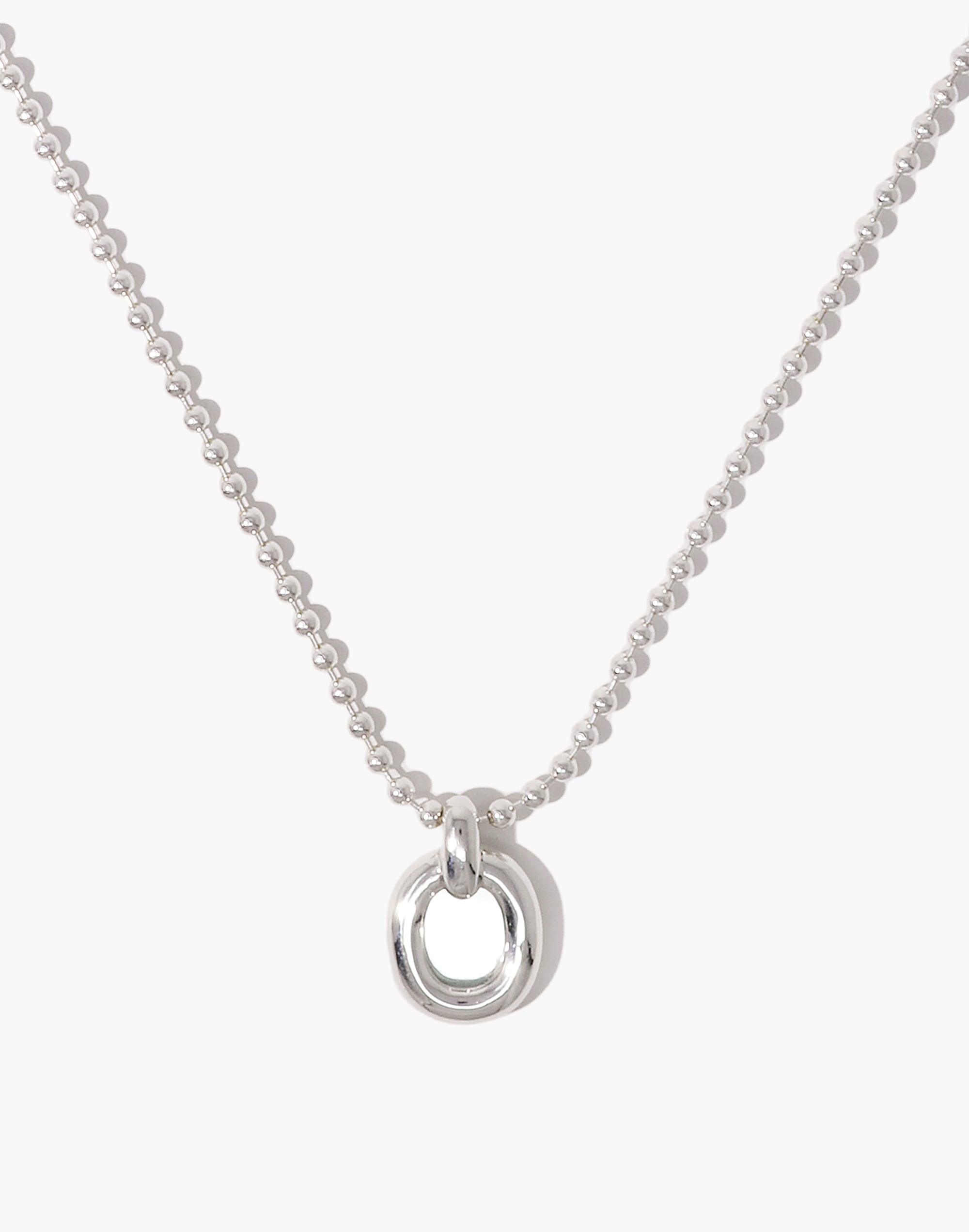 Elegant silver ball chain necklace with circular pendant, symbolizing unity and connection. Minimalist design perfect for everyday wear. Core Loop Necklace by CLED, showcasing upcycled materials and sustainable fashion.