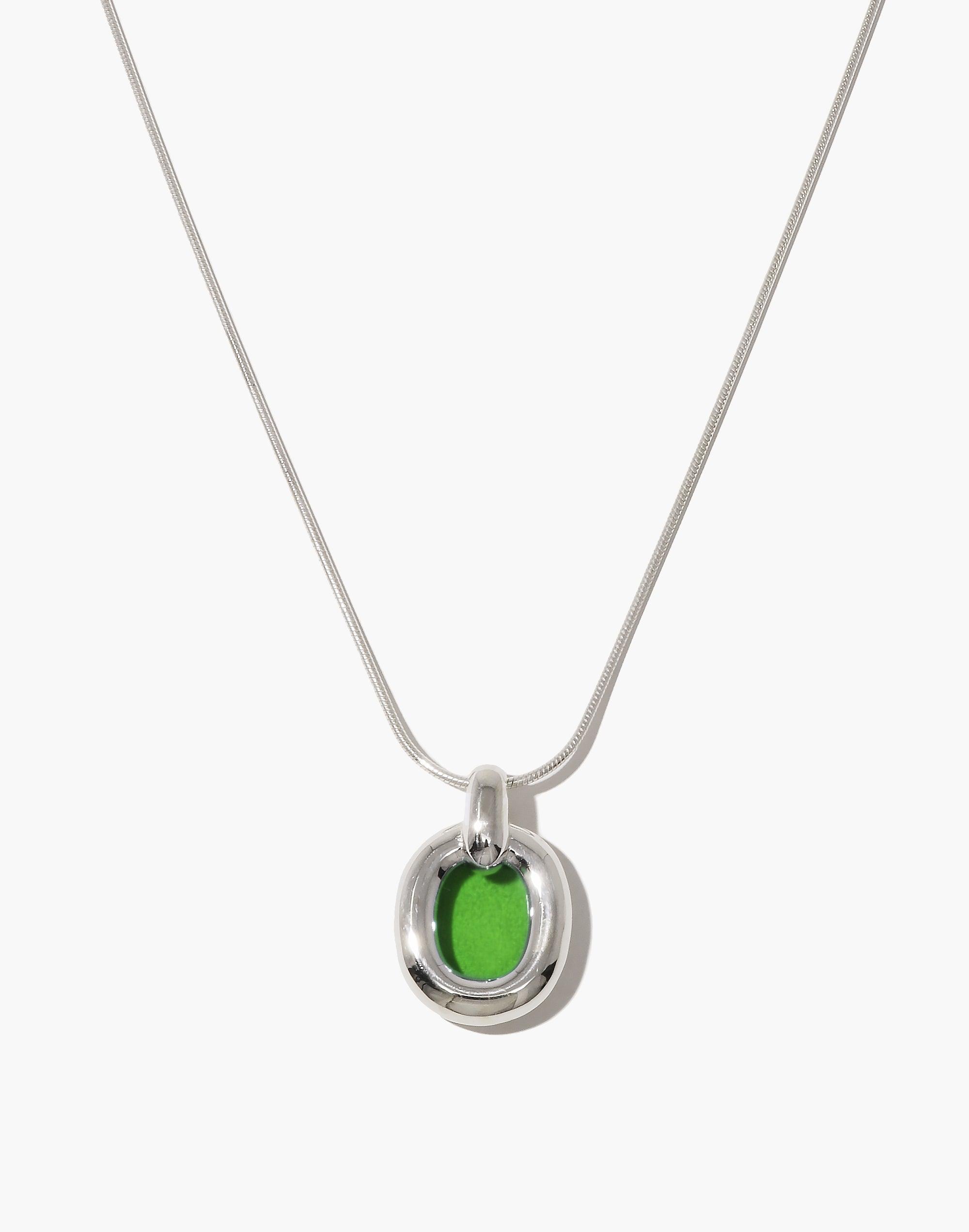 Sleek silver snake chain necklace with unique circular pendant featuring vibrant green upcycled glass, symbolizing unity and sustainability. Core Loop Necklace | Snake Chain showcases modern elegance and eco-conscious design. CLED