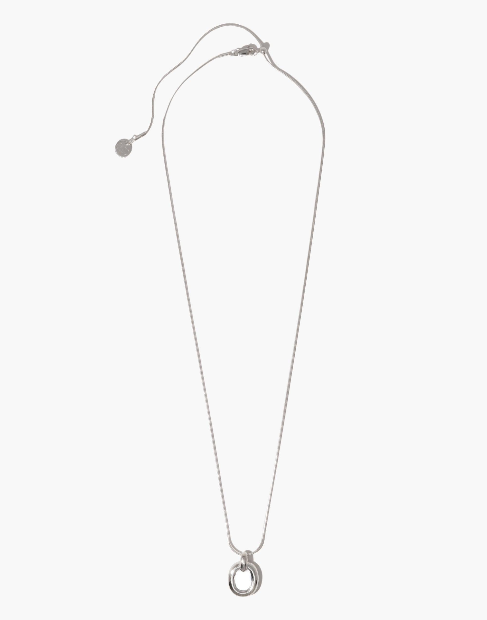 Elegant Core Loop Necklace with Snake Chain featuring a silver-toned circular pendant, symbolizing unity and sustainability. Adjustable length with sliding clasp. Upcycled design showcasing CLED's commitment to transforming discarded materials. Core Loop Necklace | Snake Chain by CLED.