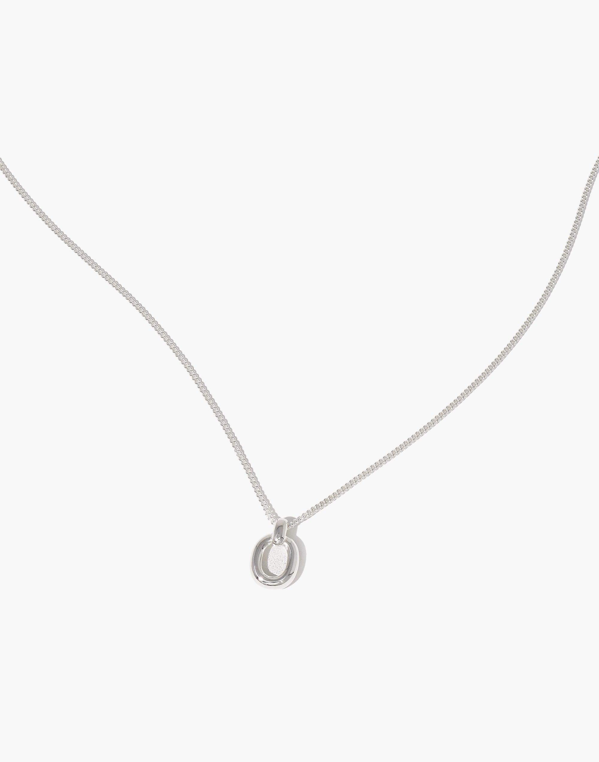 Elegant Small Core Loop Necklace featuring a delicate silver chain with a circular pendant, symbolizing unity and connection. Minimalist design perfect for everyday wear. Sustainable jewelry piece from the In The Loop collection. Small Core Loop Necklace by CLED