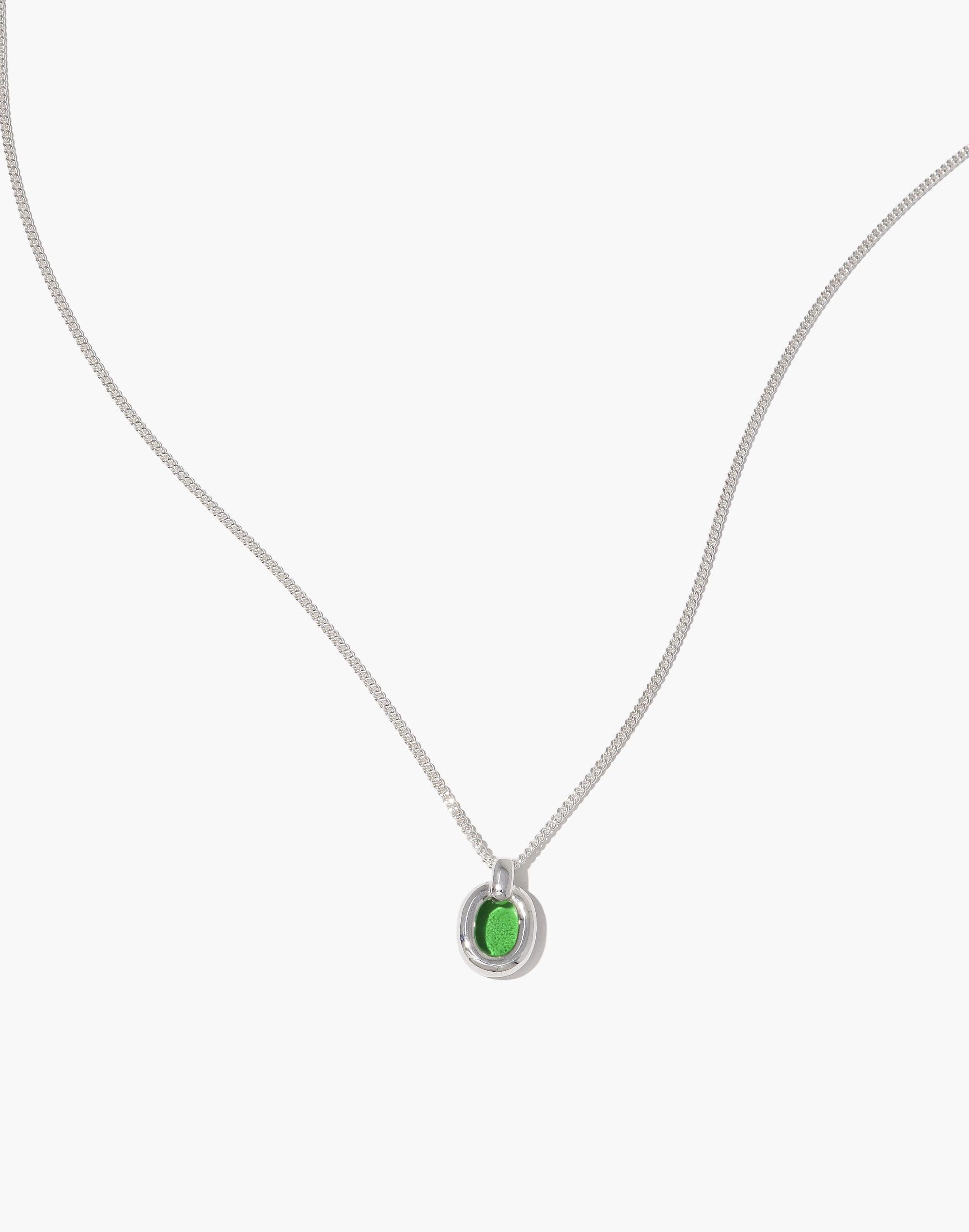 Elegant Small Core Loop Necklace featuring a delicate silver chain and a unique green pendant, showcasing sustainable design and unity. Part of the In The Loop collection, symbolizing connection and upcycling. Perfect for eco-conscious fashion lovers. Small Core Loop Necklace by CLED.