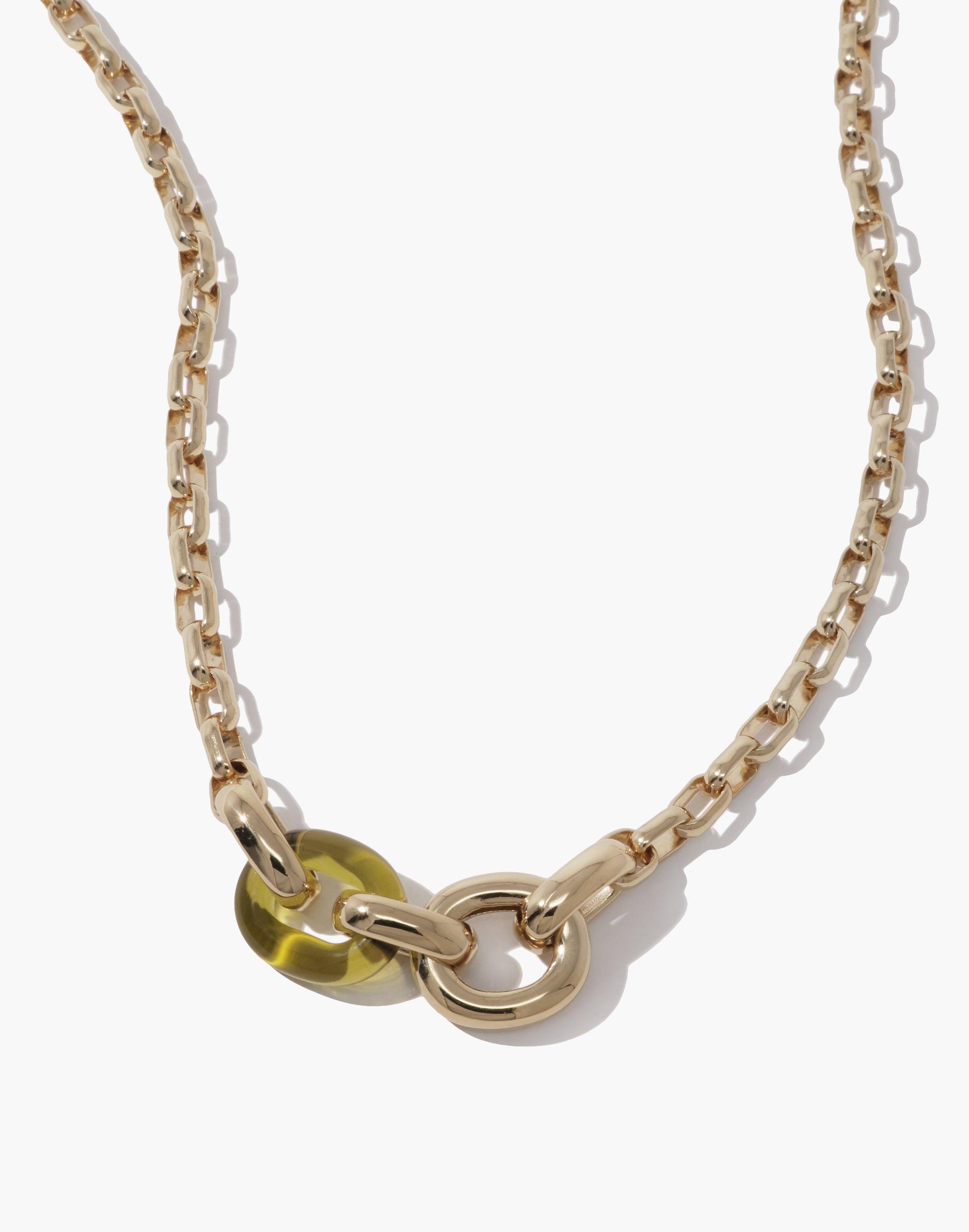 Elegant Loop Chain Necklace featuring gold-toned links with unique green accent bead, showcasing sustainable upcycled design. Symbolizes unity and connection in the In The Loop collection. Versatile accessory for conscious fashion lovers. Loop Chain Necklace by CLED.