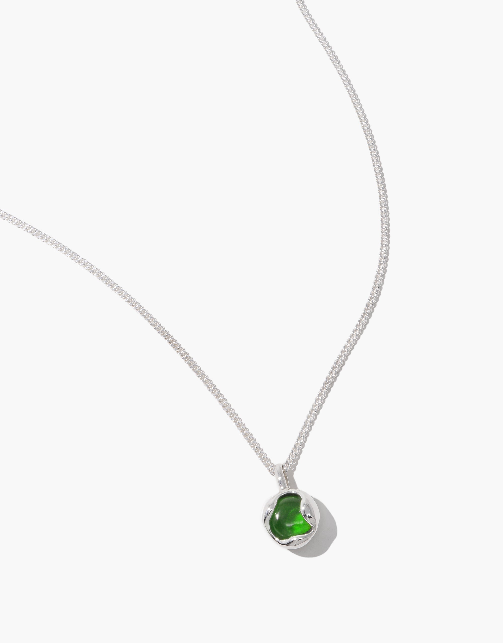 Goyo Orb Necklace with delicate silver chain and green glass sphere pendant in minimal metal setting by CLED