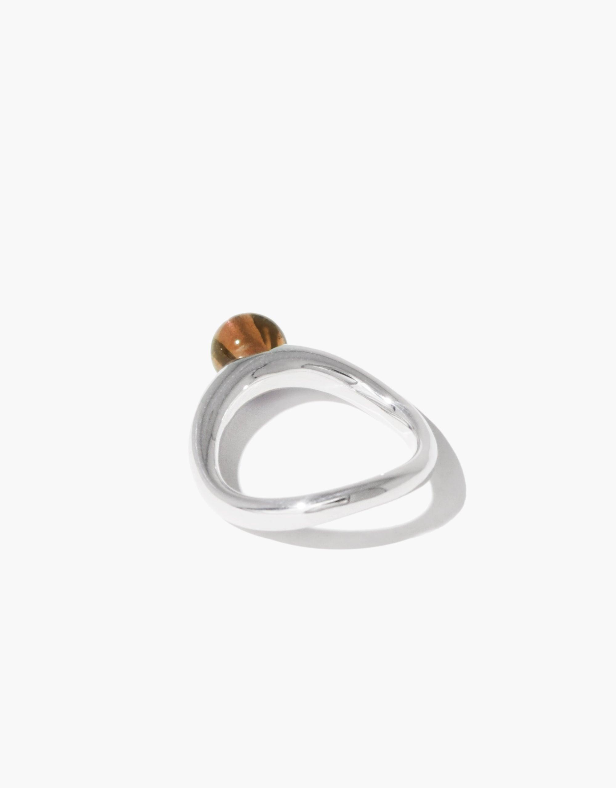 Elegant silver ring with curved design and brown stone, inspired by organic legume shapes. Pea Curve Ring | Large features a unique, nature-inspired form for a sophisticated look. CLED