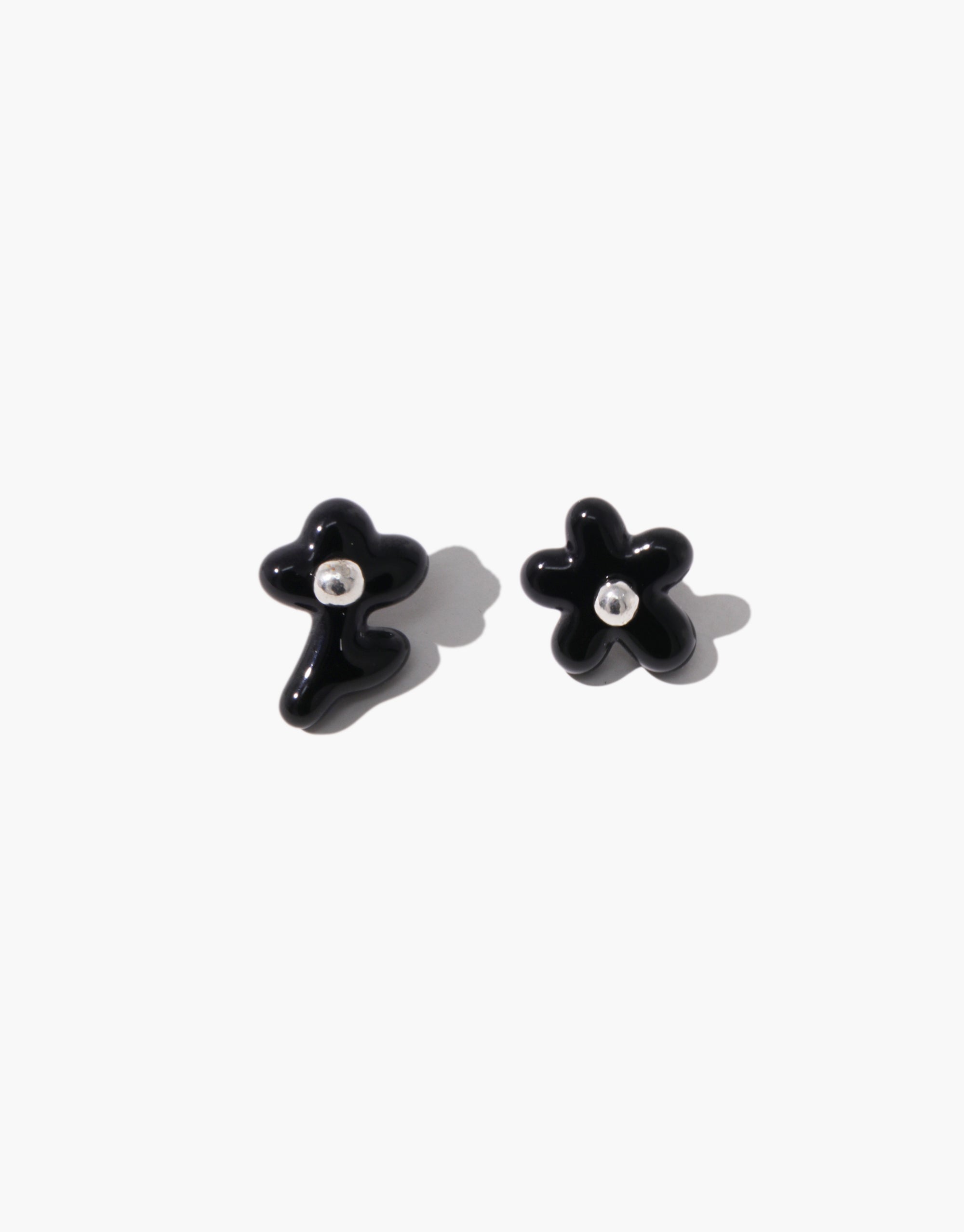 Mismatched black floral Petal Icon Stud Earrings with crystal accents, showcasing asymmetrical design by CLED