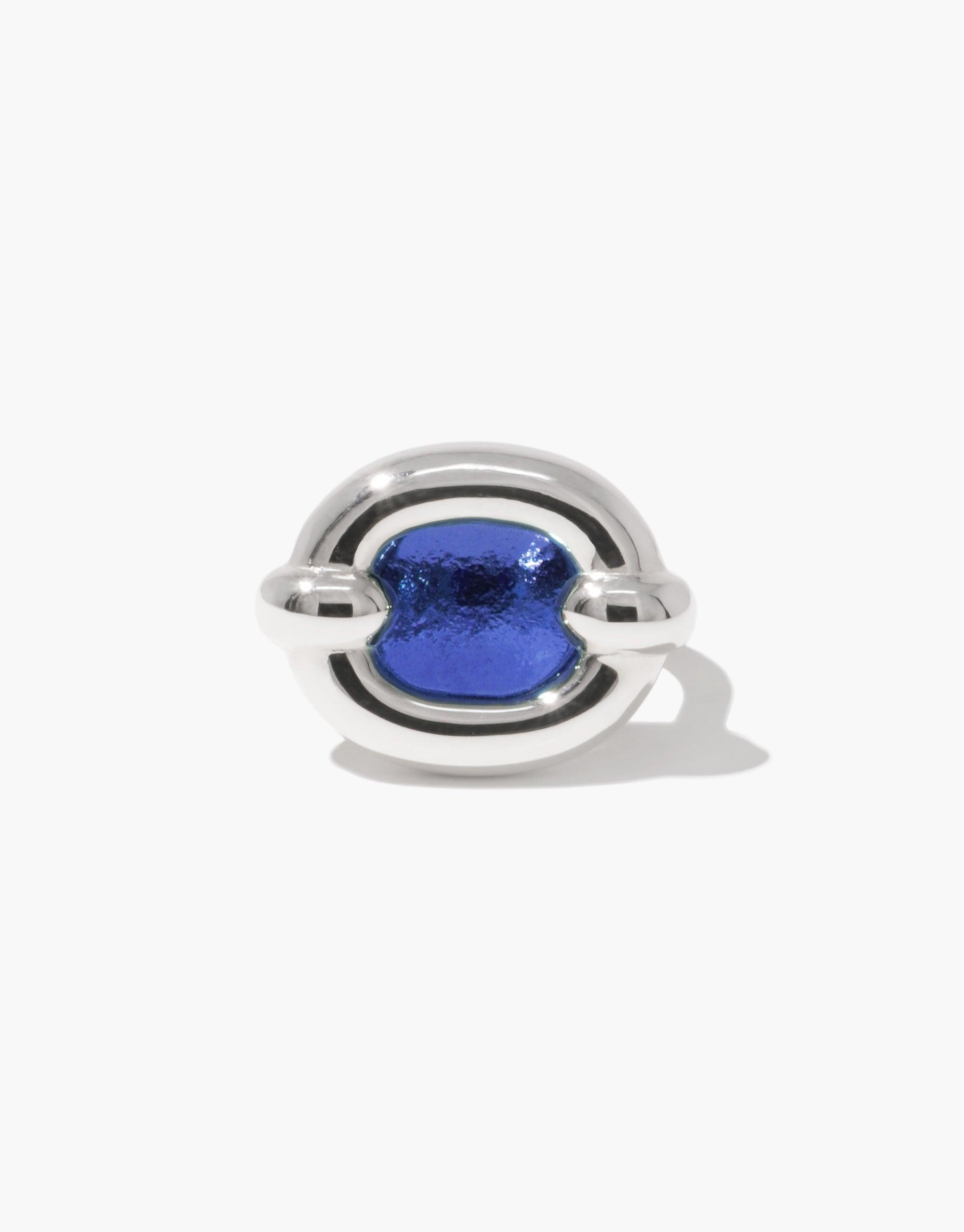 Core Loop Ring | Large featuring a sleek silver metal design with a vibrant blue eco gem encased in the center. Unique mirror-like finish allows for functional reflection. Modern and stylish jewelry piece by CLED.