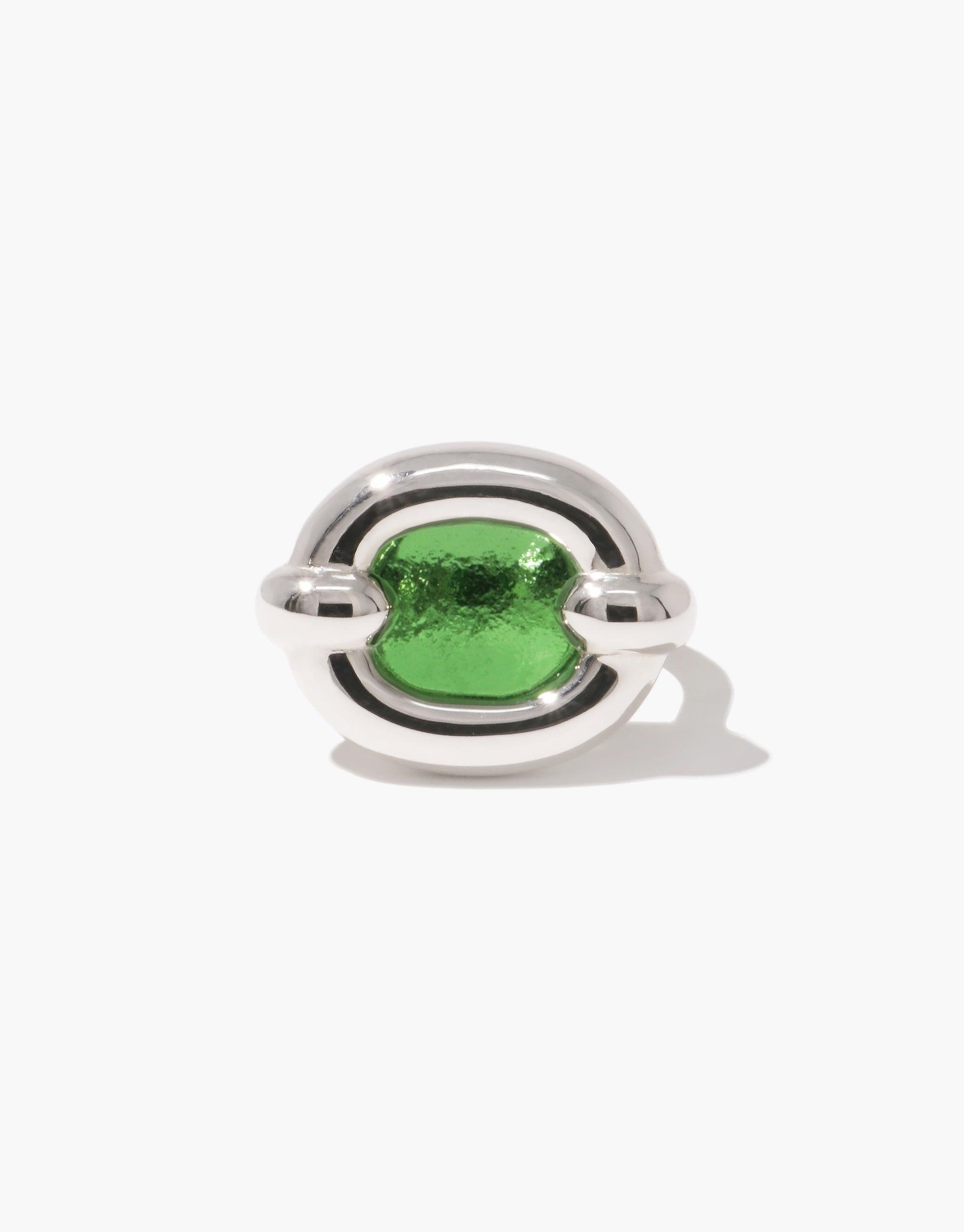 Core Loop Ring | Large featuring a sleek silver metal design with a vibrant green eco gem encased in the center. The ring's unique mirror-like surface offers both style and functionality. An elegant, modern piece of jewelry by CLED.