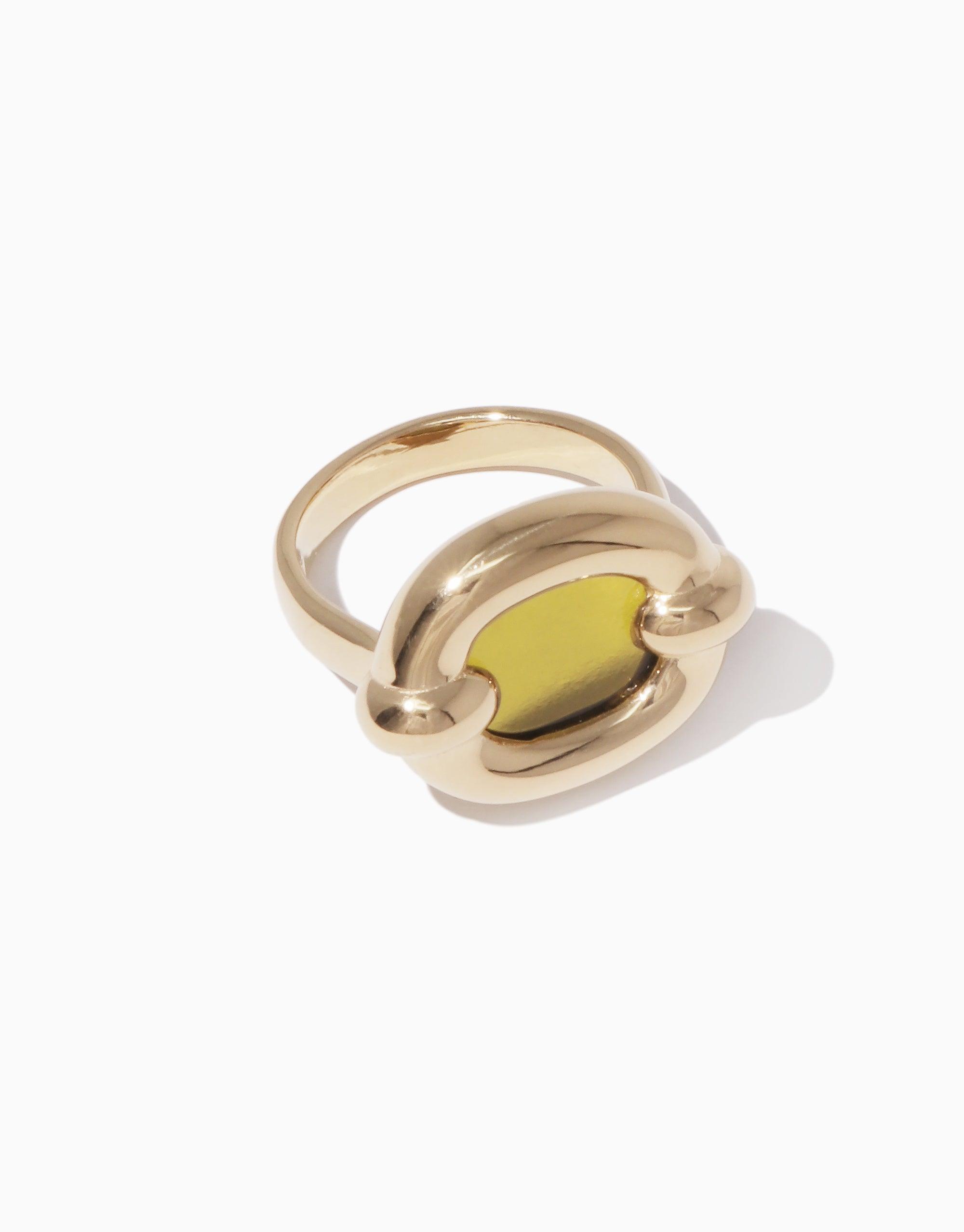 Gold-toned Core Loop Ring with large yellow eco gem centerpiece, showcasing unique seamless setting technique. Elegant design features functional mirror surface for practical use. Stylish and versatile accessory by CLED. Core Loop Ring | Large.