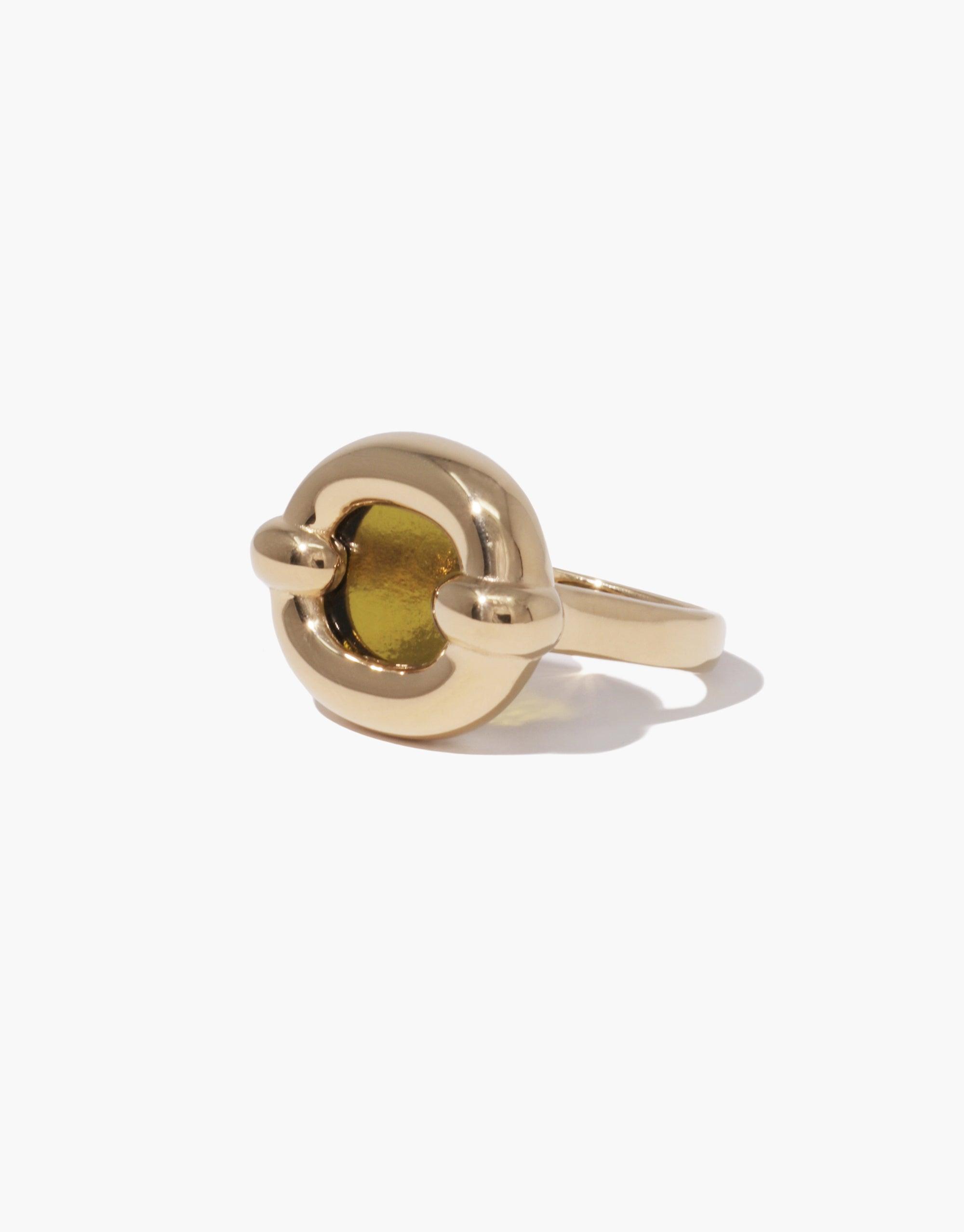 Elegant gold-toned Core Loop Ring featuring a seamless setting with a vibrant eco gem encased in metal. The ring's unique design incorporates a functional mirror, perfect for quick checks or capturing beautiful reflections. A stylish and practical accessory by CLED - Core Loop Ring | Large.