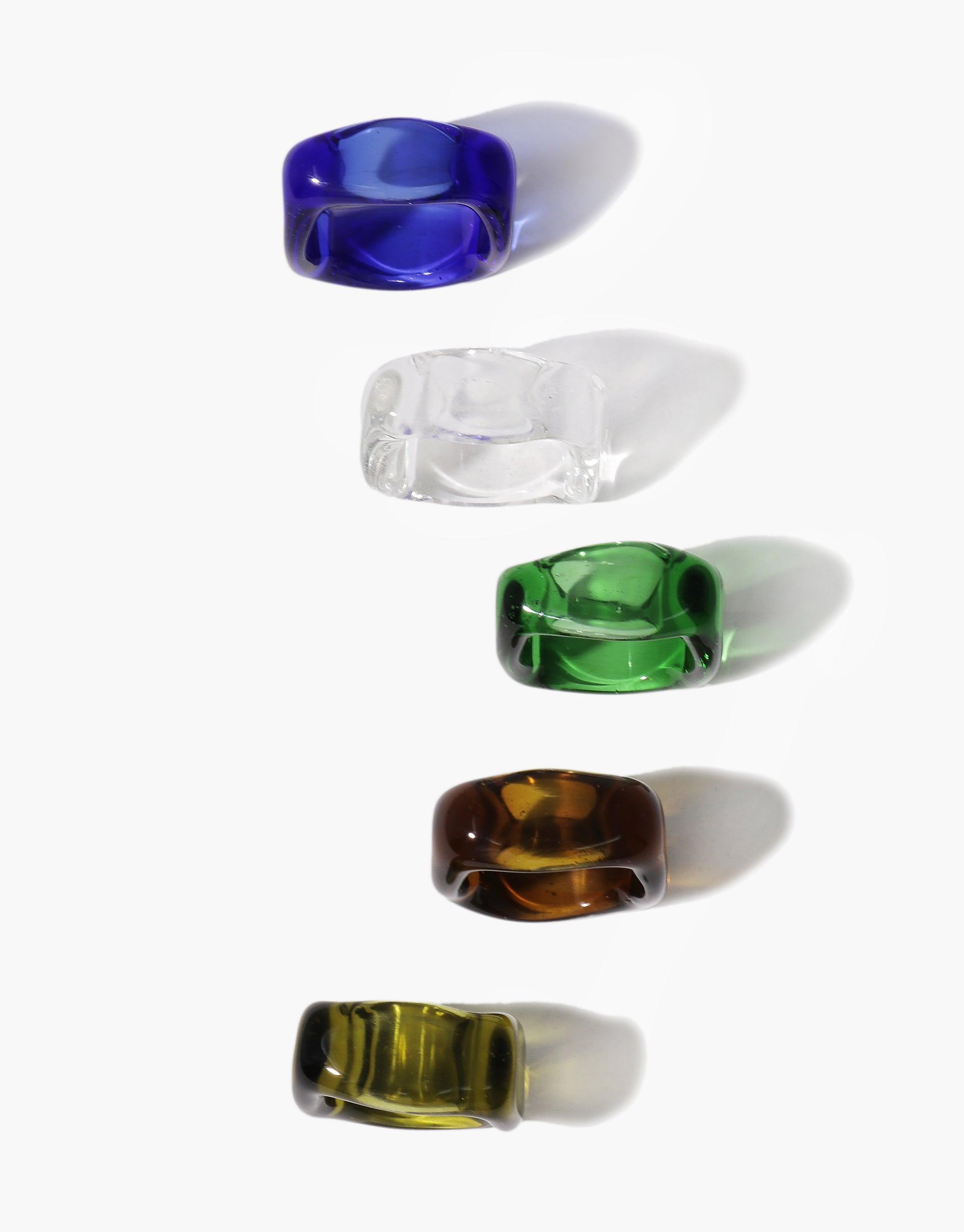 Colorful glass Dice Rings in blue, clear, green, amber, and yellow, showcasing the unique square-shaped design with rounded interiors. Personalized engraving available on three sides for self-empowerment and daily reminders. Dice Ring | I am by CLED