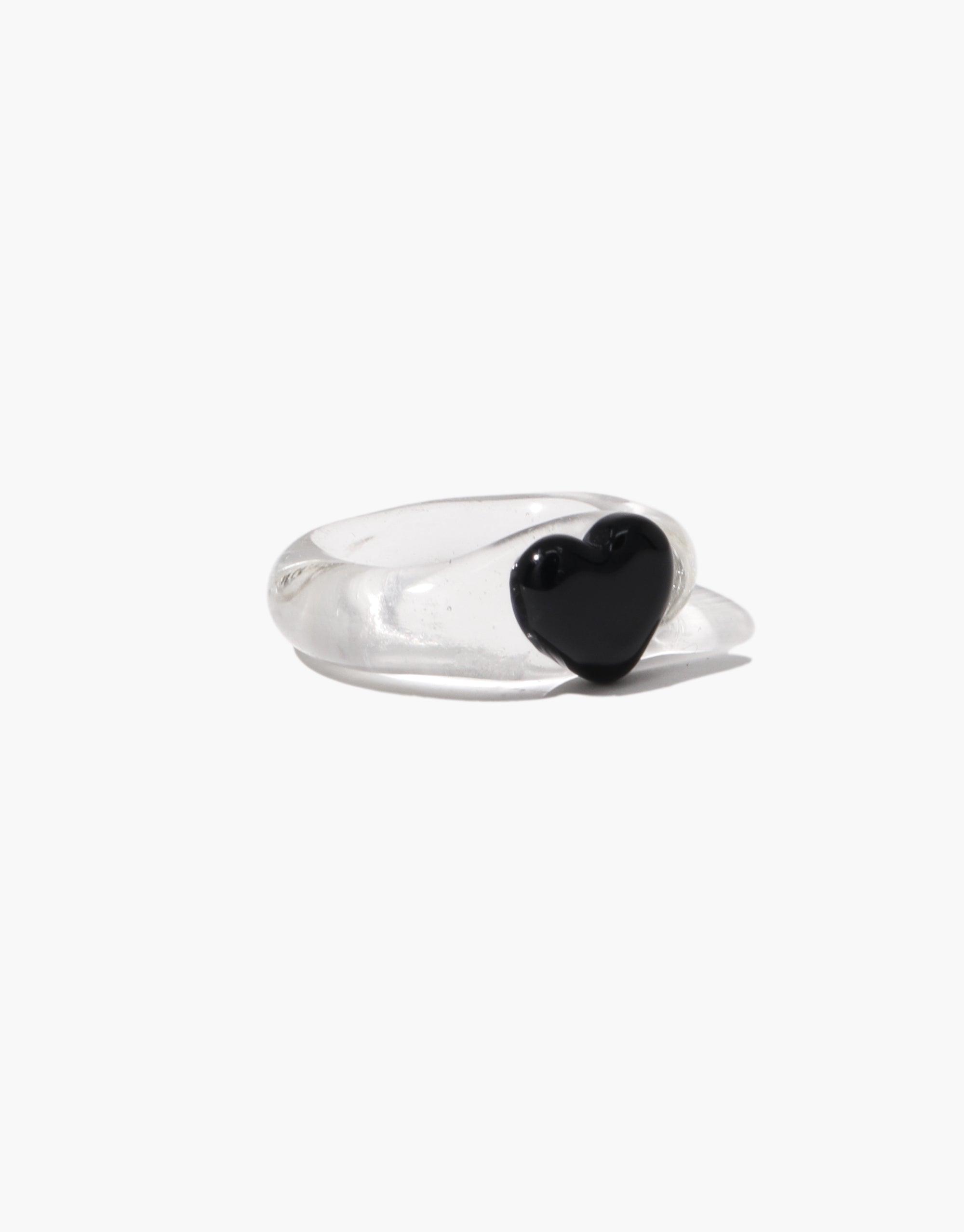 Elegant silver ring featuring a small black heart-shaped icon, showcasing a minimalist design perfect for everyday wear. The Heart Icon Ring | Small combines simplicity with style, making it a versatile accessory for any outfit. CLED