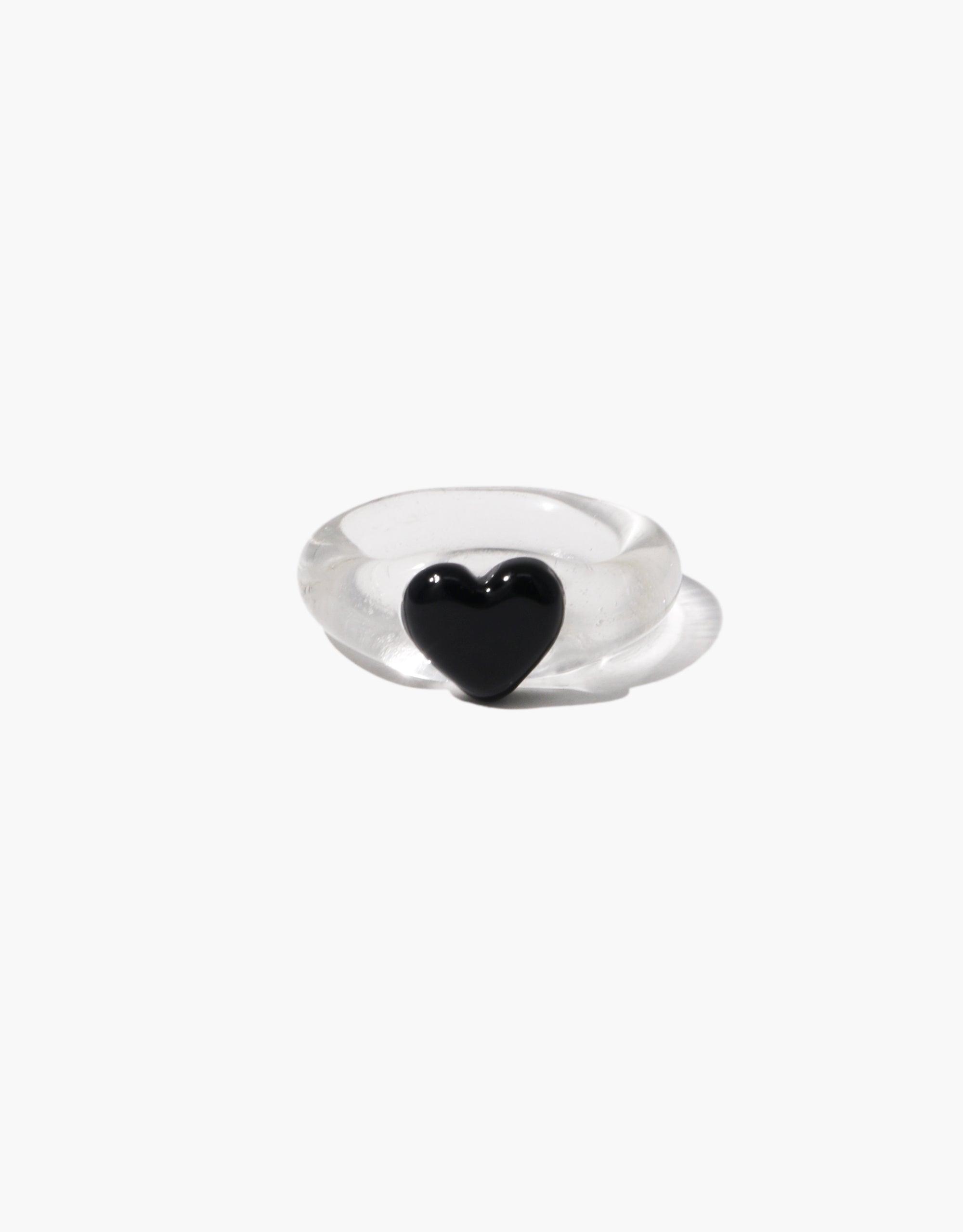 Elegant Heart Icon Ring | Small featuring a clear band with a black heart-shaped centerpiece. Minimalist design perfect for everyday wear or as a romantic gesture. Stylish and modern jewelry piece by CLED.