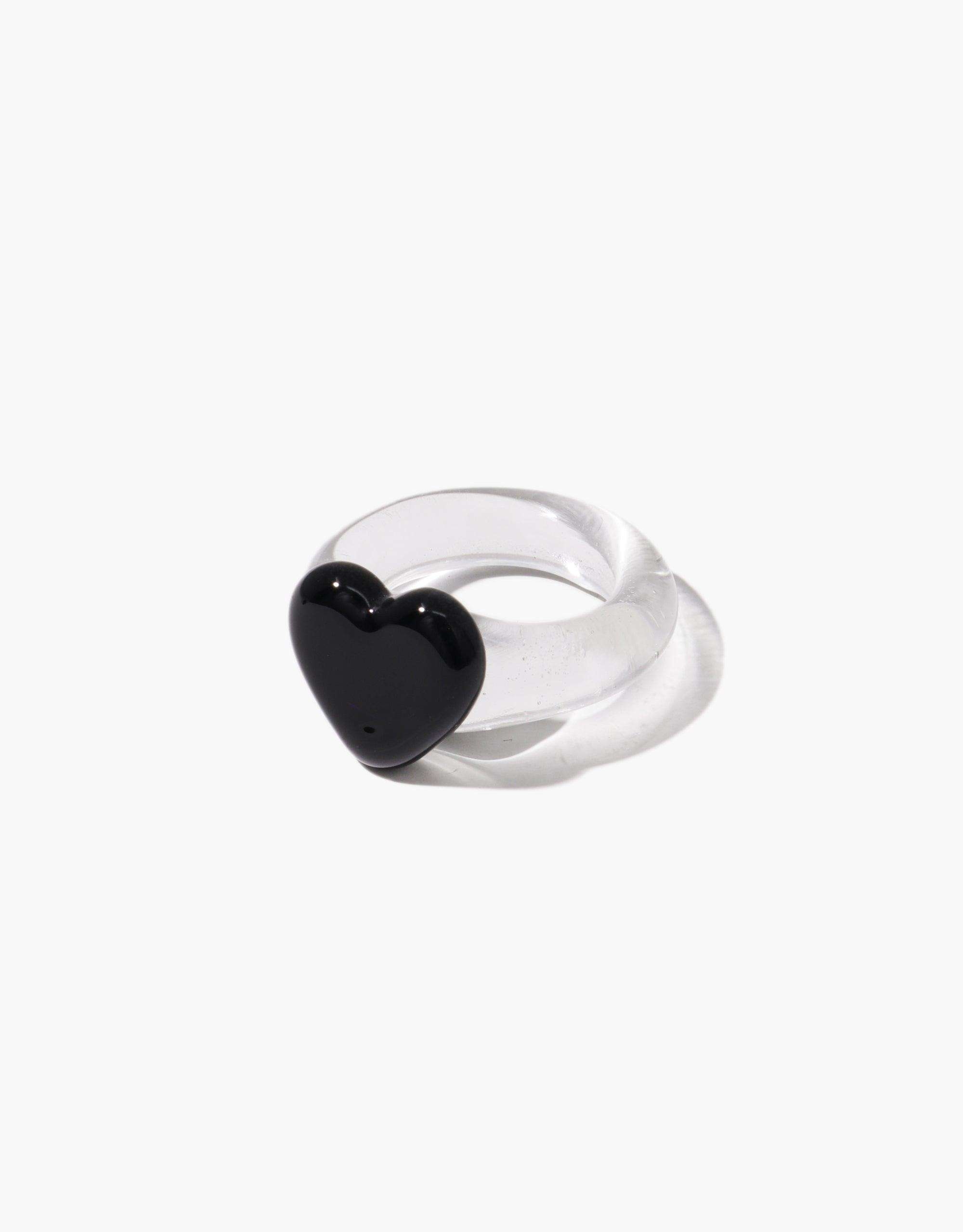 Clear acrylic ring featuring a large black heart-shaped embellishment, showcasing a stylish contrast between transparent and opaque elements. Unique and eye-catching design perfect for making a statement. Heart Icon Ring | Large by CLED