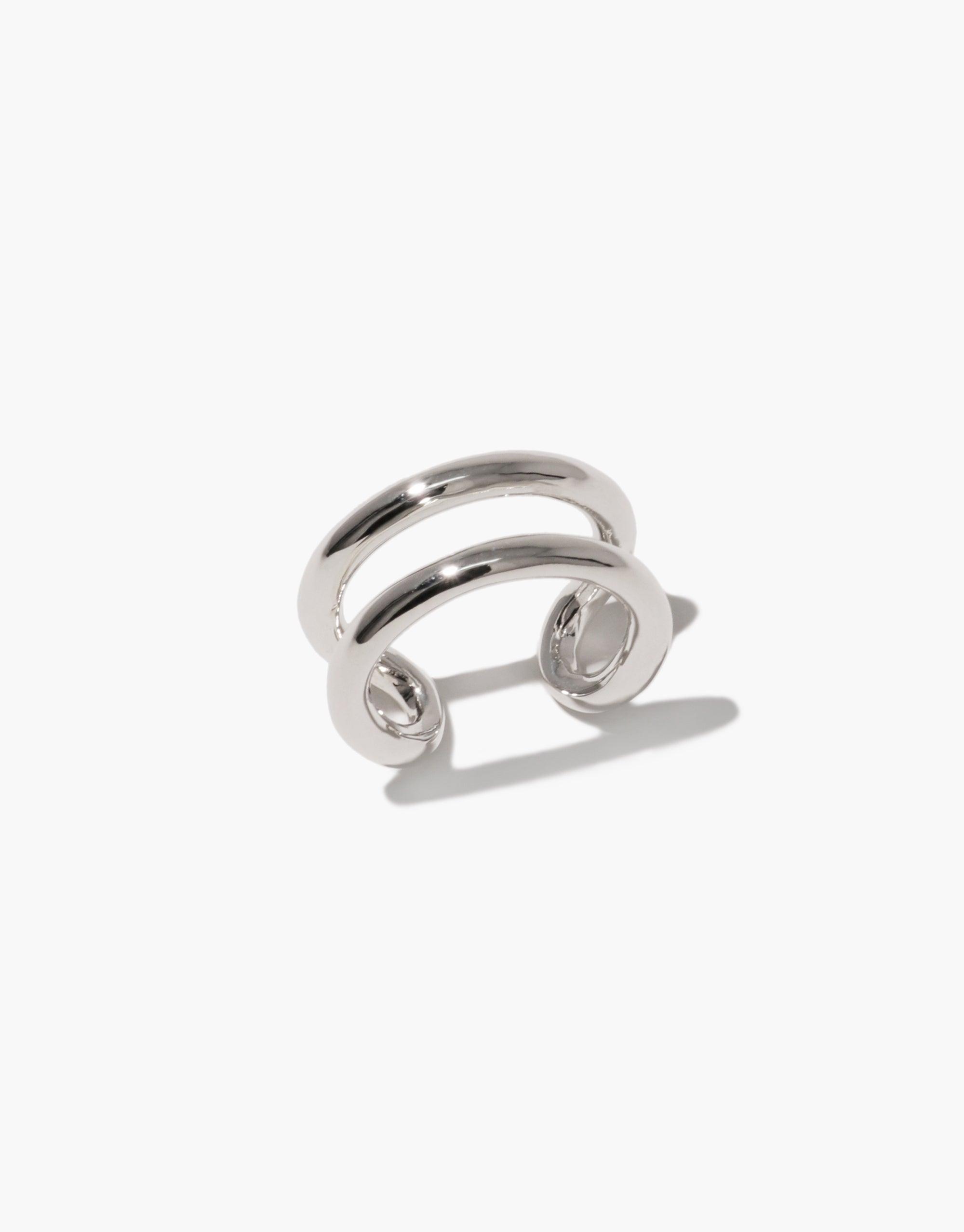 Sleek silver Infinite Loop Ring with double band design, symbolizing unity and connection. Upcycled jewelry piece from CLED's In The Loop collection, embodying sustainability and togetherness. Infinite Loop Ring by CLED