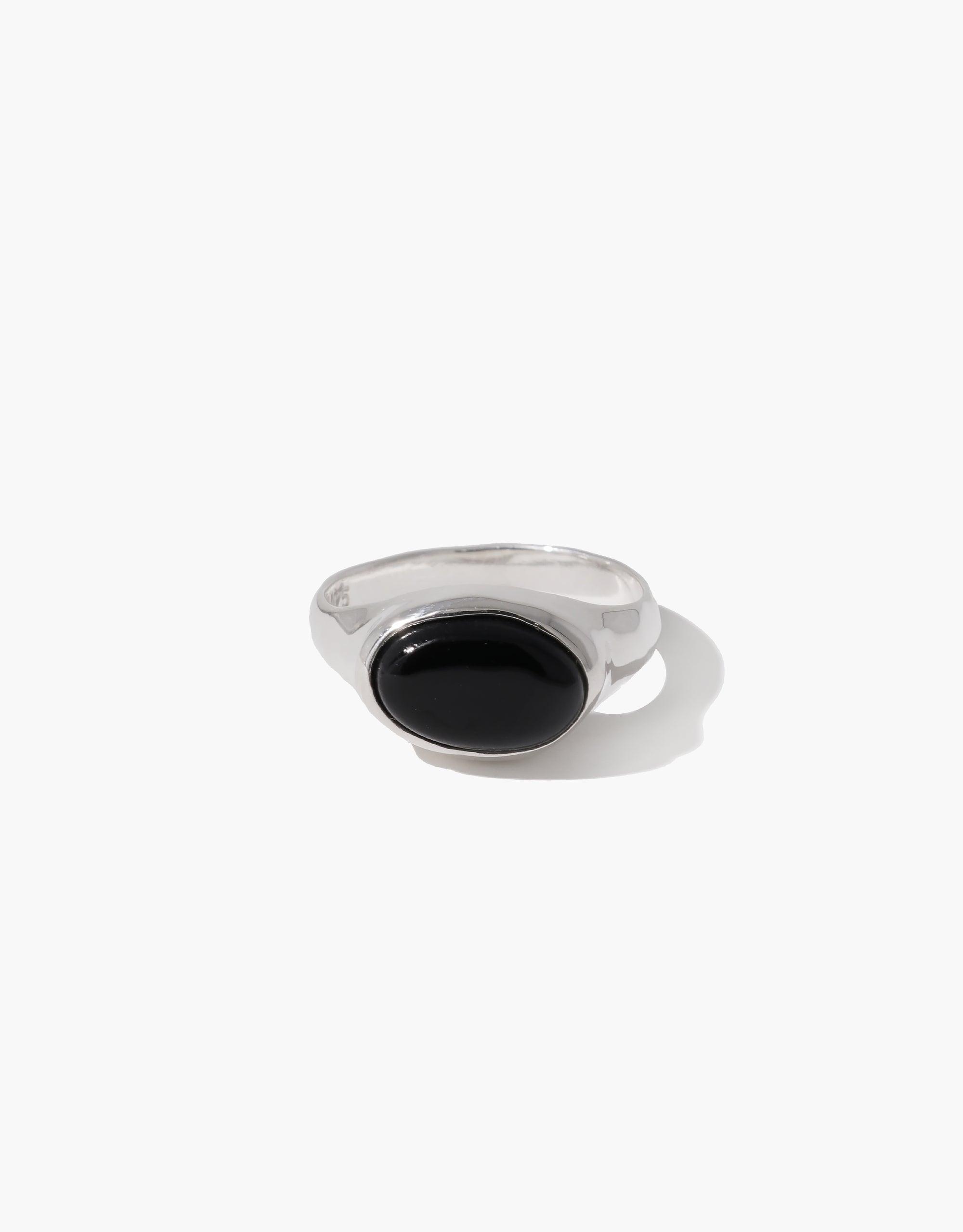 Oval Sculpture Ring featuring a sleek silver band with a large oval-shaped black stone setting. Elegant and modern design perfect for everyday wear or special occasions. Handcrafted eco-friendly jewelry by CLED.