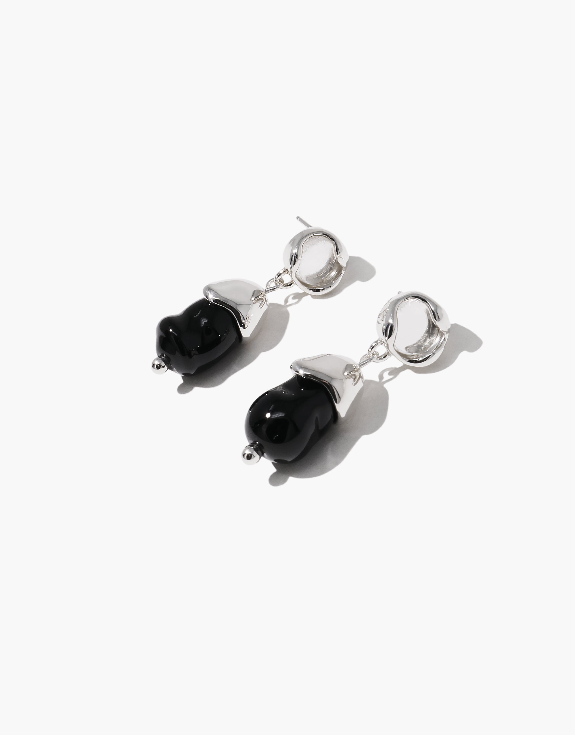 Solace Drop Earrings featuring black glass drops with silver hoops, modern organic design by CLED