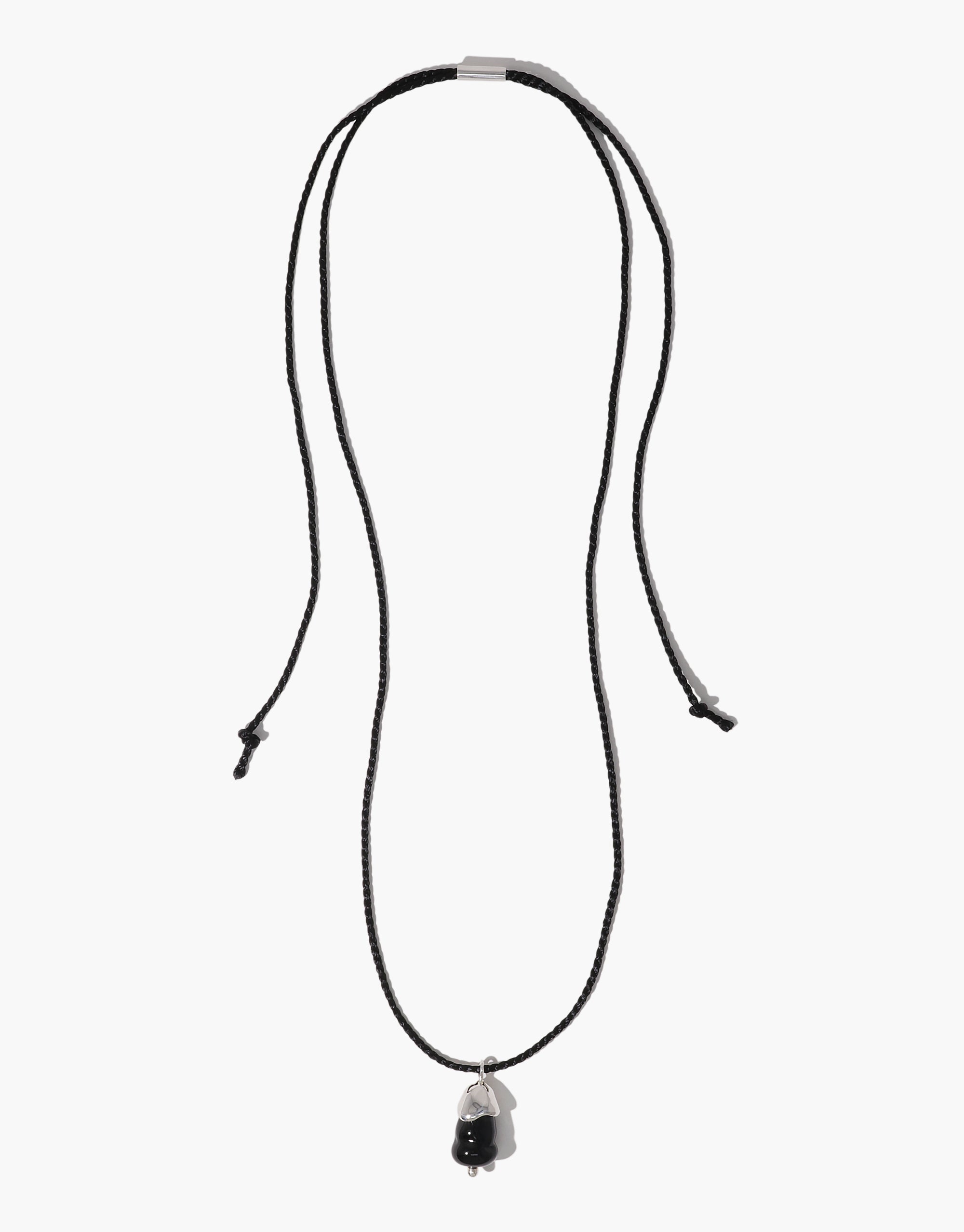 Solace Drop Necklace featuring black cord and silver-set clear eco pendant with organic shape design by CLED