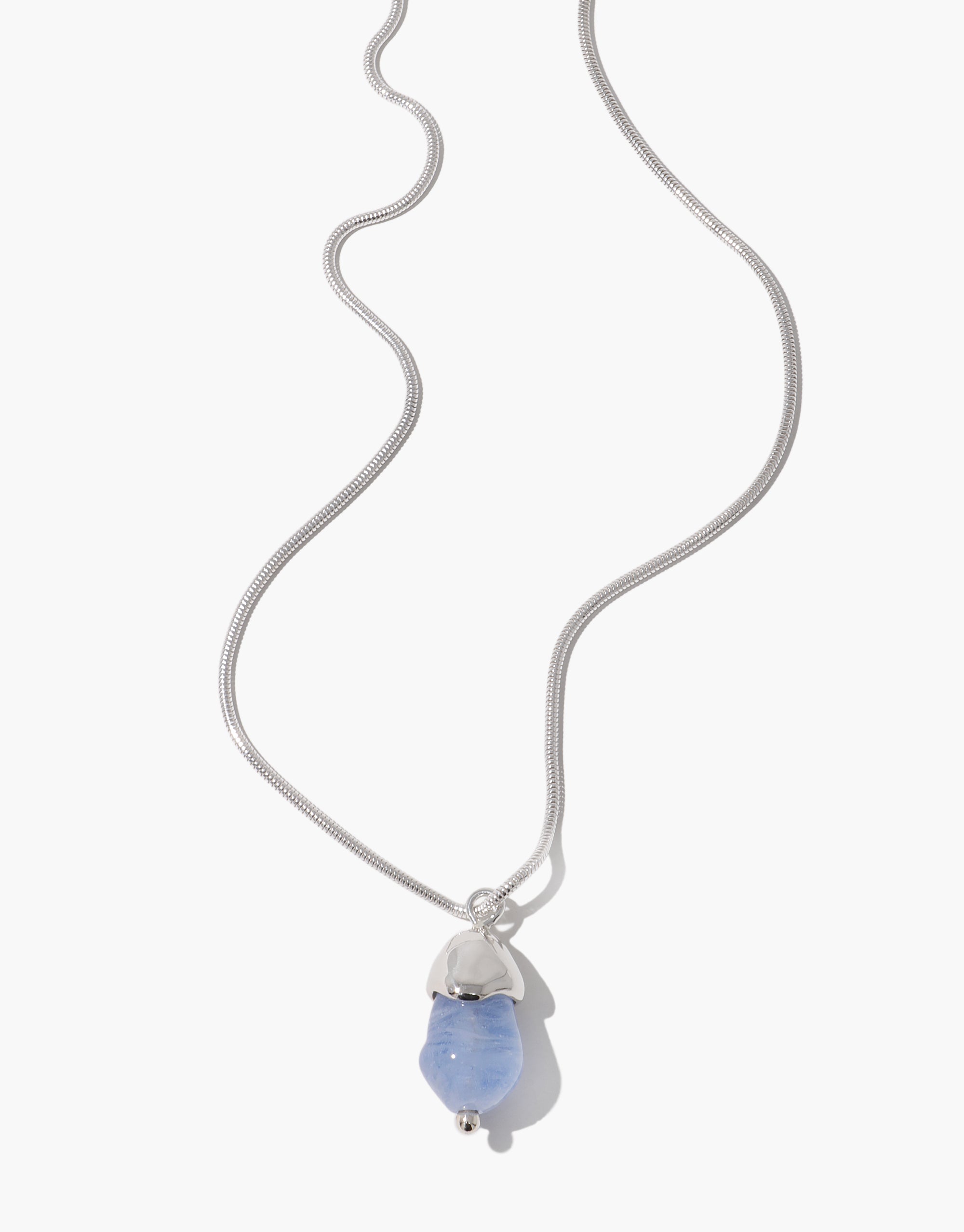 Solace Drop Necklace featuring silver snake chain with light blue glass pendant in minimalist design by CLED