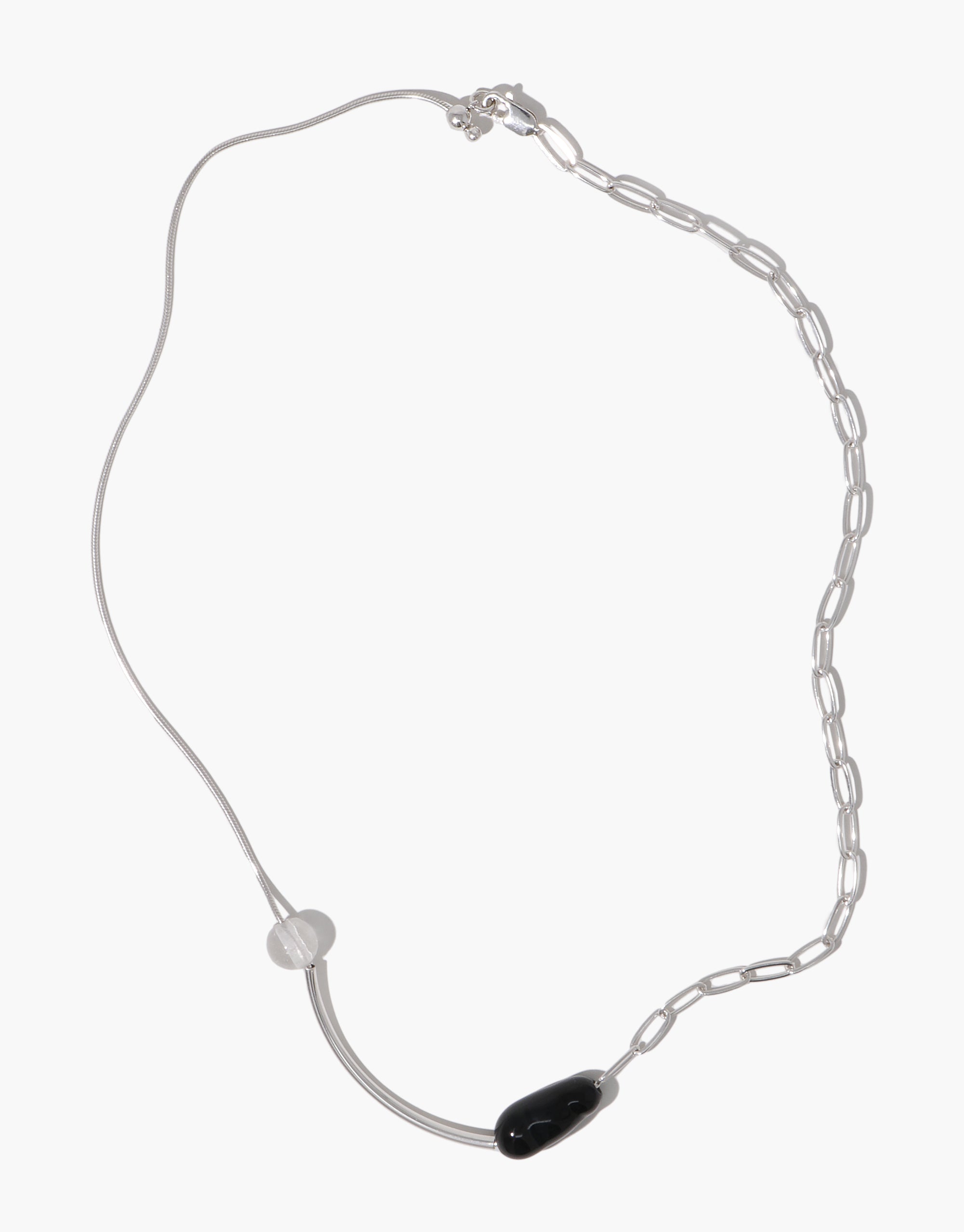 Still Necklace featuring asymmetrical silver chains with clear and black glass beads, sculptural curved design by CLED