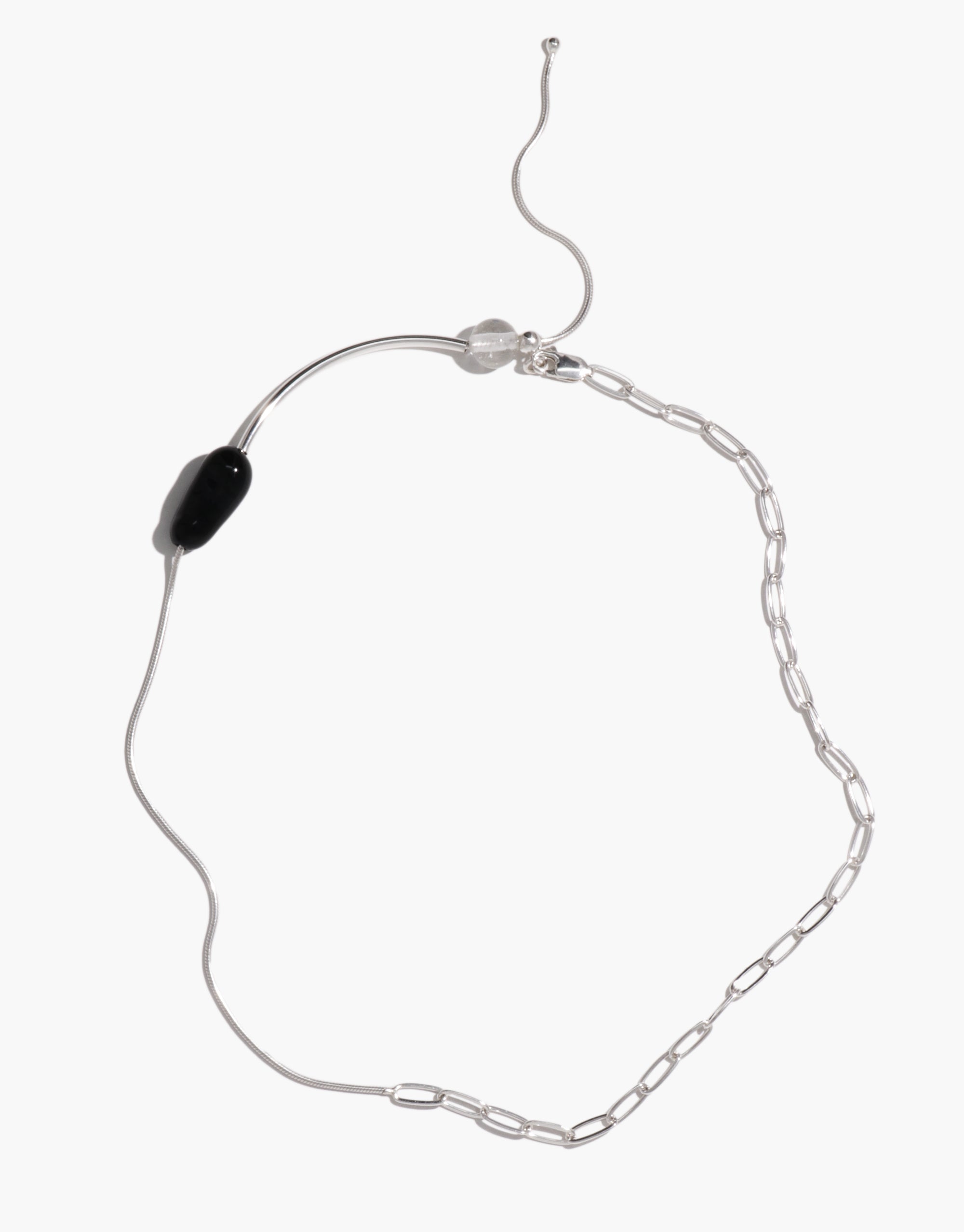 Still Necklace featuring curved silver wire, black glass bead, and delicate chain links in asymmetrical design by CLED