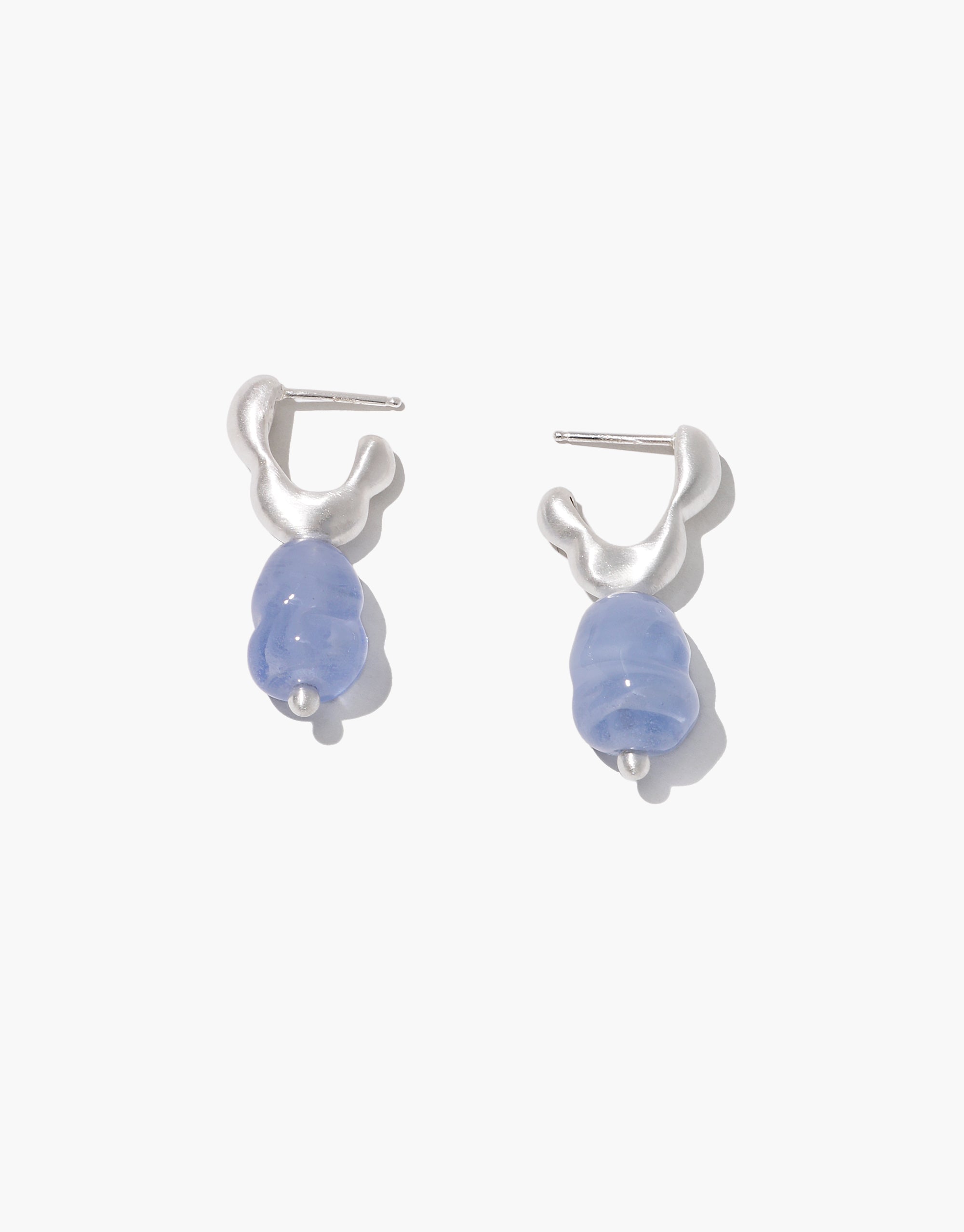 Sculptural Flow Drop Hoop Earrings with wavy silver hoops and light blue glass drops, sustainable jewelry by CLED