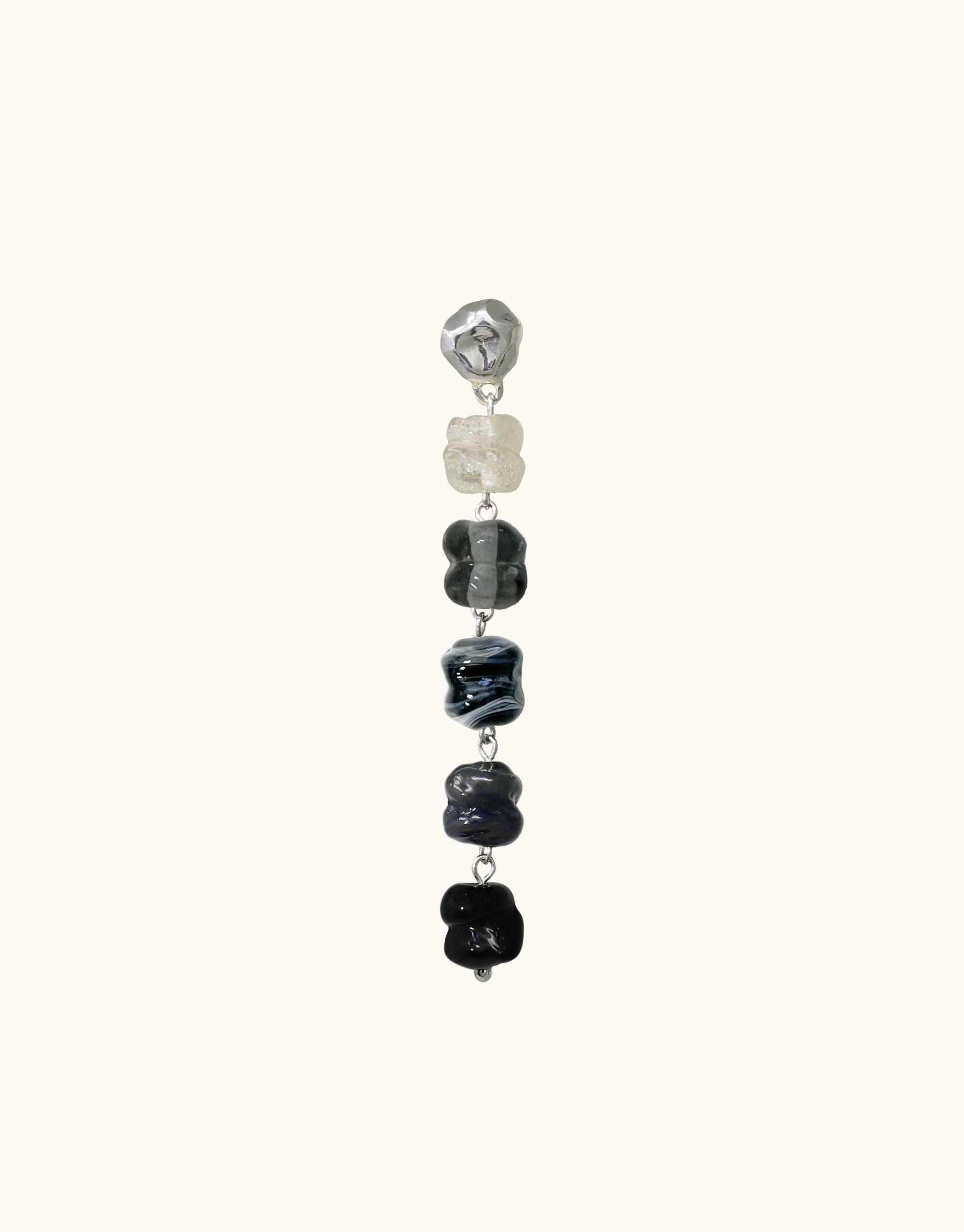 Shades of Nature Basalt Earrings featuring a gradient of eco-friendly glass beads in varying shades of grey and black, inspired by volcanic canyon formations. Handcrafted, sustainable jewelry piece from the Terrain Collection by CLED