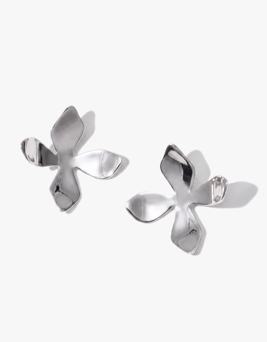 Elegant Petal Earrings in recycled sterling silver, featuring delicate four-petal flower design inspired by California wildflowers. Handcrafted in Los Angeles, these 1.5-inch long earrings showcase a lightweight, nature-inspired aesthetic. Perfect for spring and summer styling. CLED Petal Earrings.