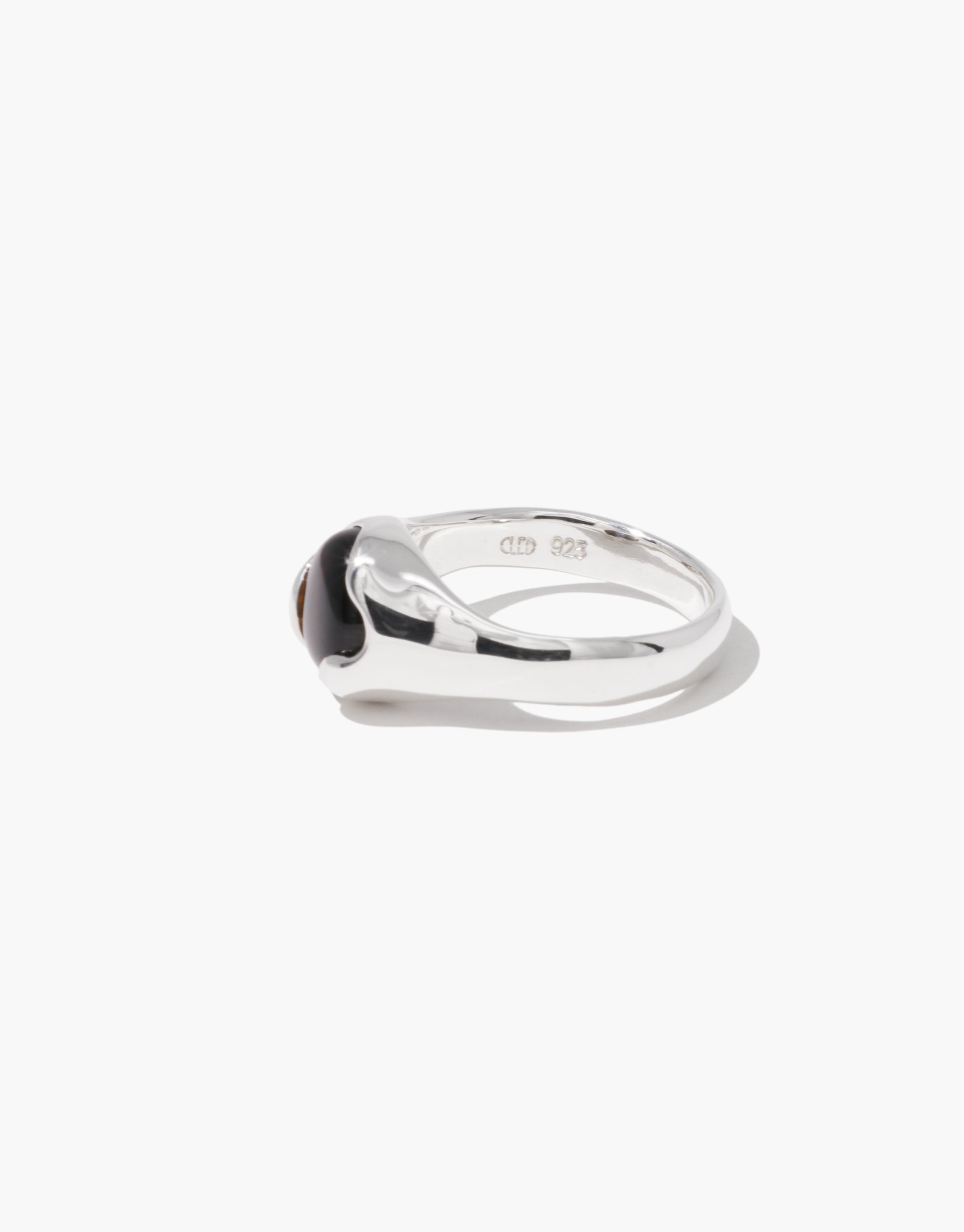Modern Orb Ring in sterling silver with dark center stone, showcasing minimalist curved design - CLED