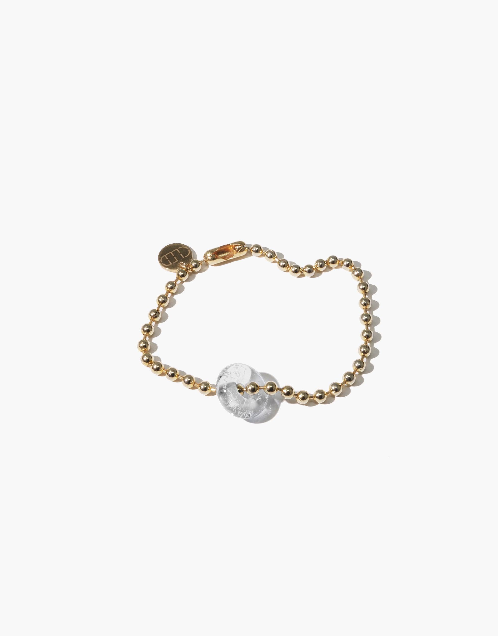 Donut Ball Bracelet featuring a gold-toned beaded chain with a translucent spherical eco gem centerpiece, showcasing sustainable elegance and handcrafted design by CLED