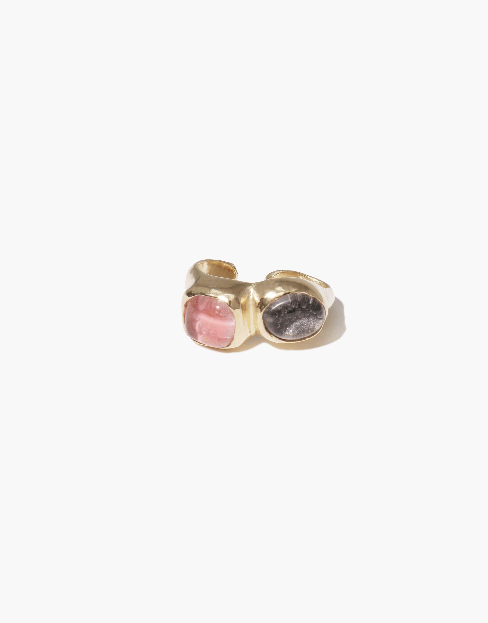 Duo Sculpture Ear Cuff featuring two contrasting stones - pink and dark grey - set in a gold-toned metal band. Unique handcrafted design with an open-ended structure for easy wear. Stylish and sustainable jewelry by CLED.